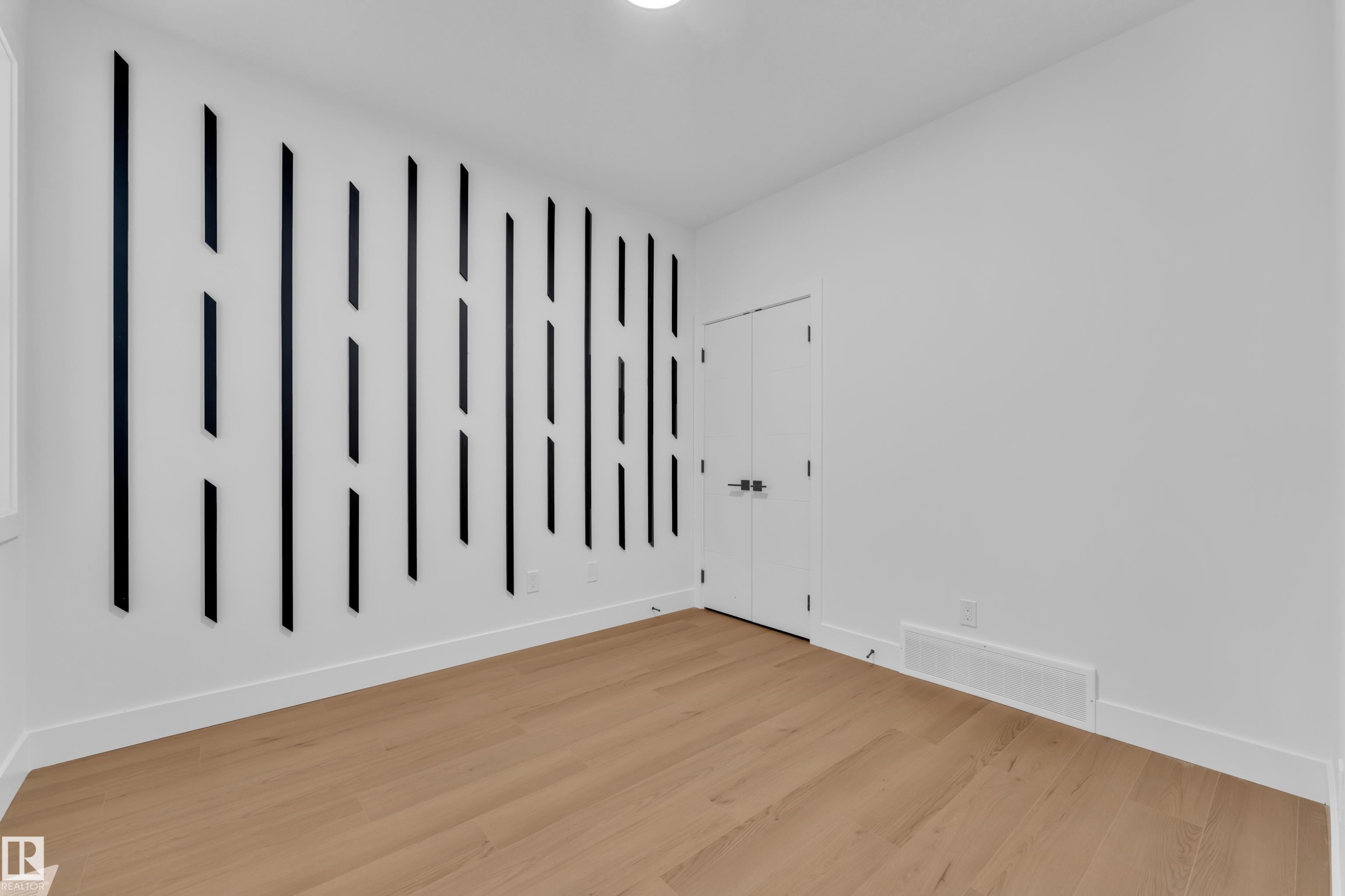 Spare room featuring light wood finished floors - 733 Astoria Way, Devon, AB - Indoor Photo Showing Other Room