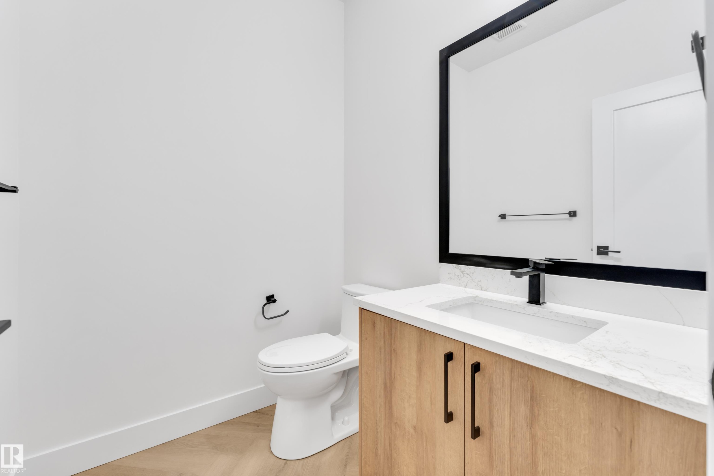 Bathroom with vanity and light wood-type flooring - 737 Astoria Way, Devon, AB - Indoor Photo Showing Bathroom