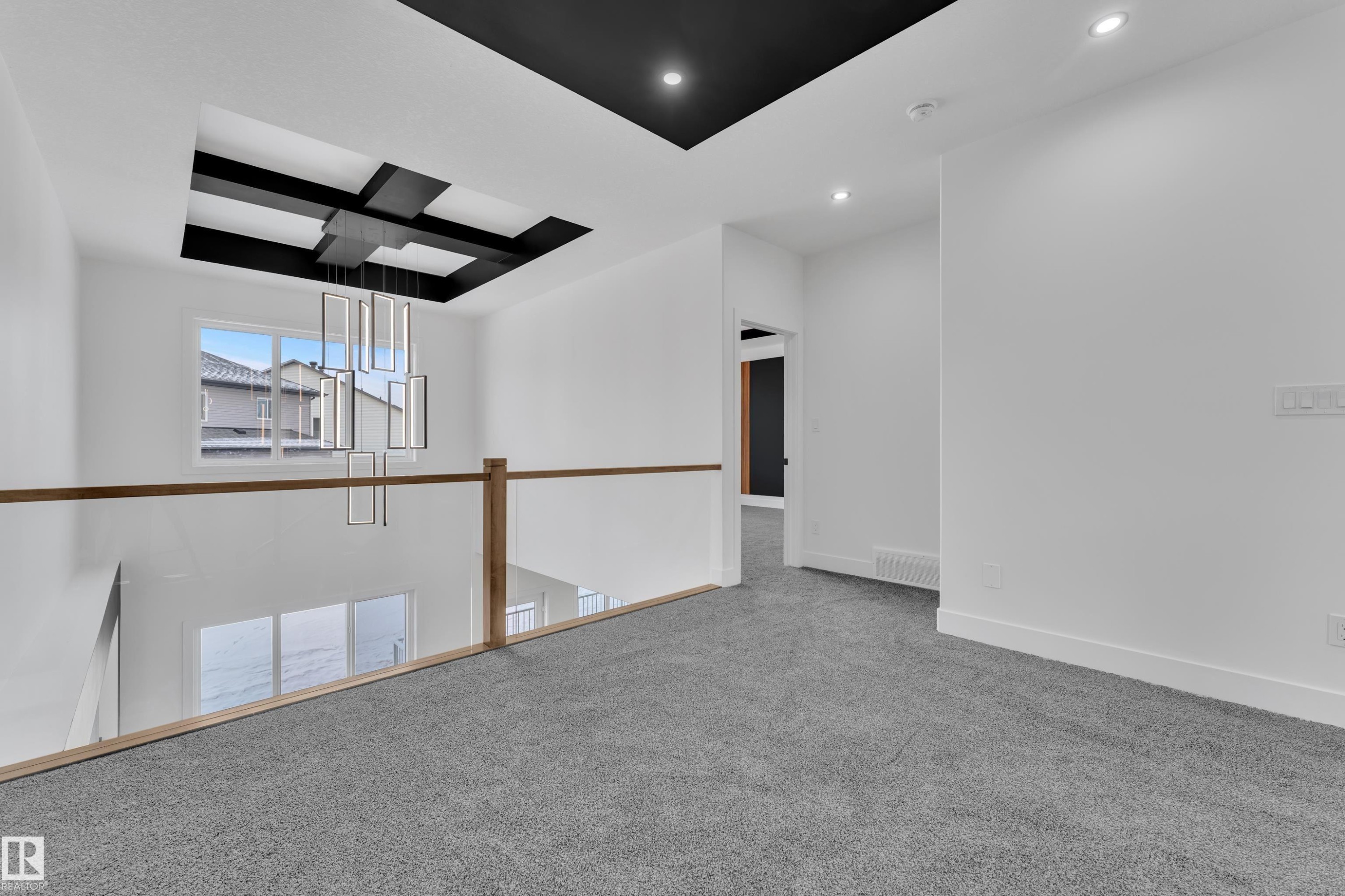 Spare room with carpet flooring and baseboards - 737 Astoria Way, Devon, AB - Indoor Photo Showing Other Room