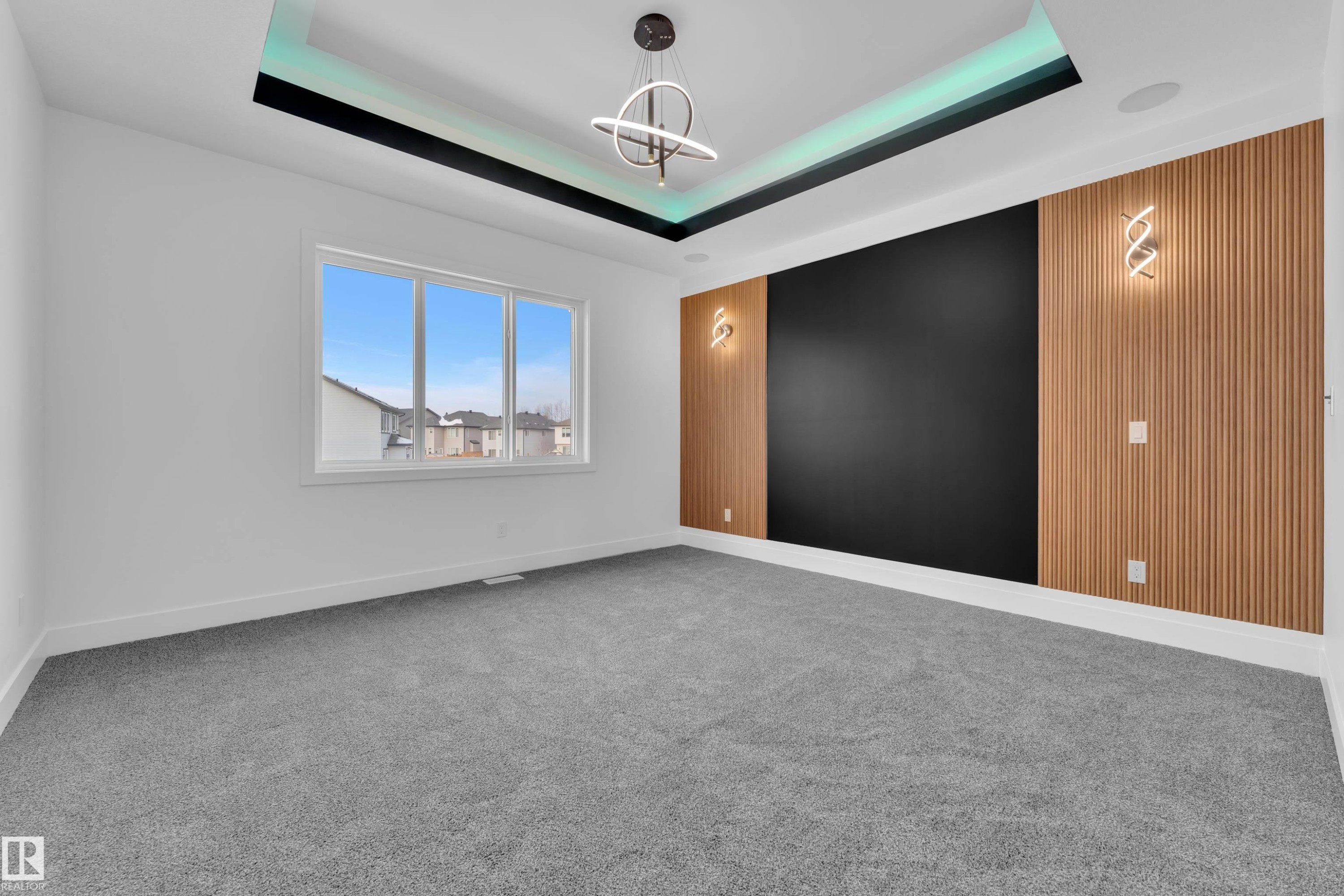 Unfurnished room with carpet flooring and suspended lighting - 737 Astoria Way, Devon, AB - Indoor Photo Showing Other Room