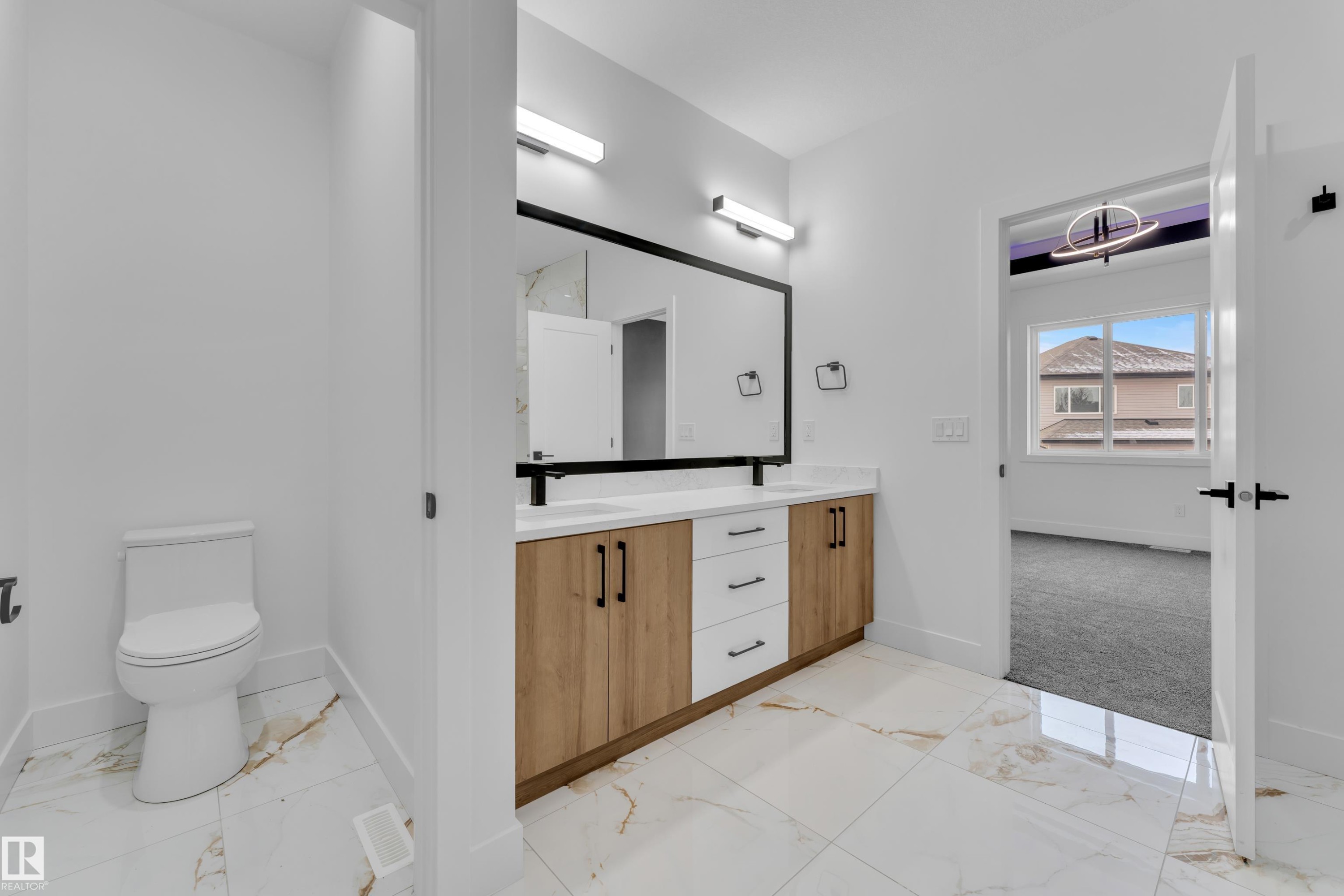 Bathroom with light marble finish floors and double vanity - 737 Astoria Way, Devon, AB - Indoor Photo Showing Bathroom