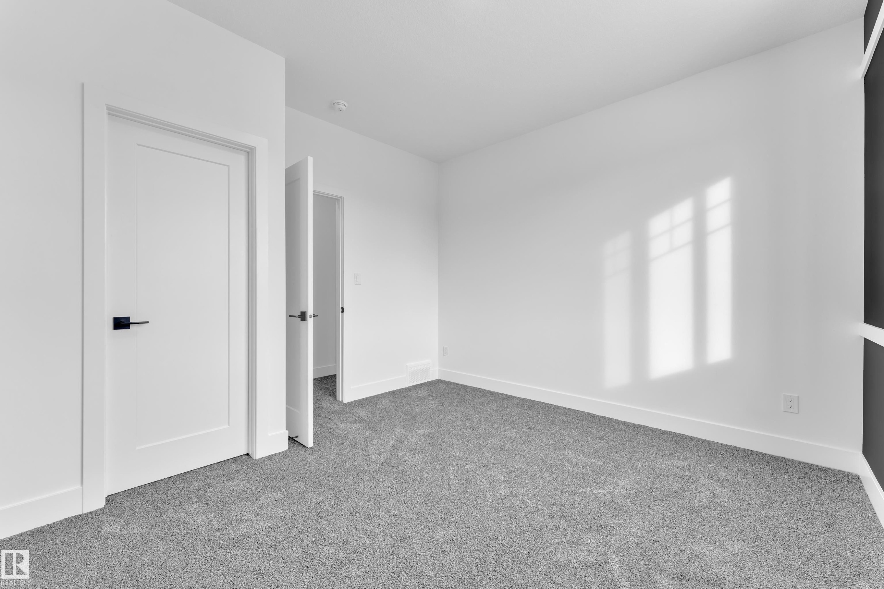 Unfurnished bedroom with carpet and baseboards - 737 Astoria Way, Devon, AB - Indoor Photo Showing Other Room