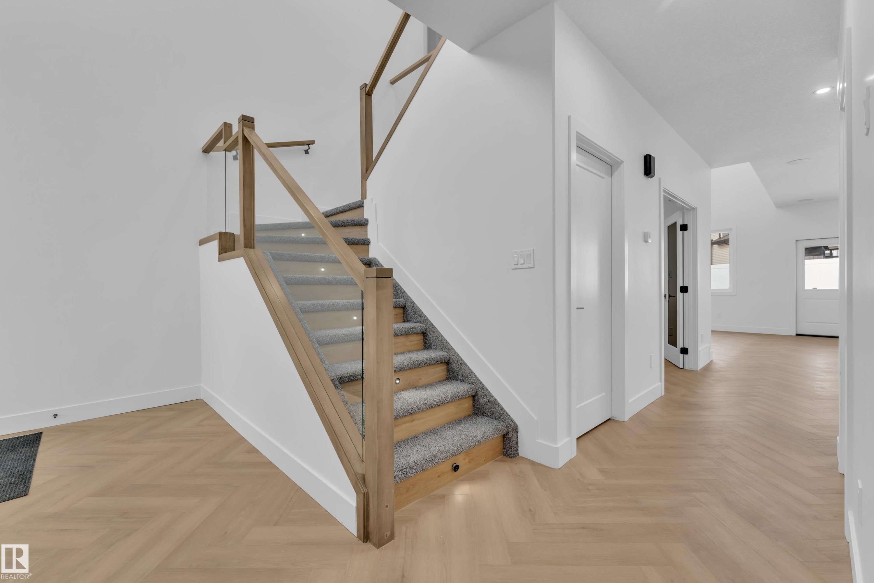 Staircase featuring parquet flooring - 737 Astoria Way, Devon, AB - Indoor Photo Showing Other Room