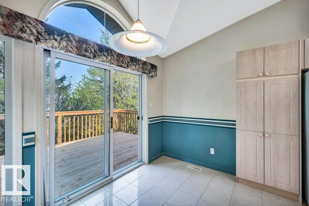 Unfurnished dining area with lofted ceiling and light tile patterned flooring - 112 Haddow Close, Edmonton, AB - Photo Showing Other Room