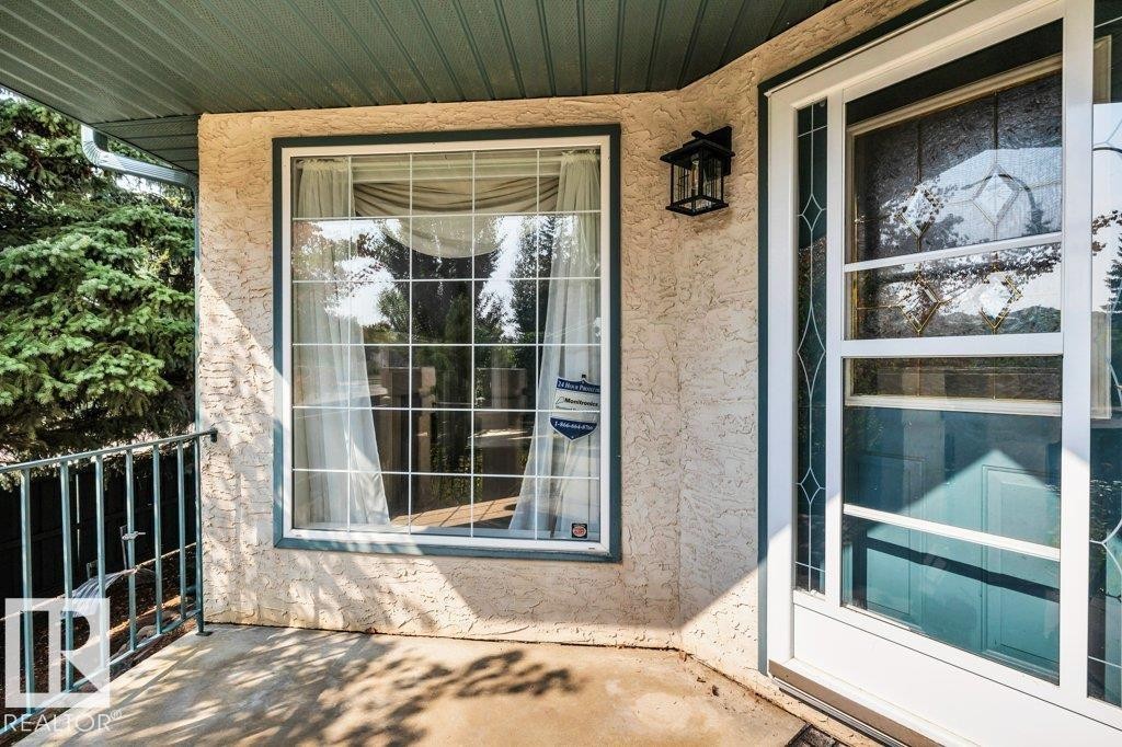 Doorway to property featuring stucco siding - 112 Haddow Close, Edmonton, AB - Outdoor With Deck Patio Veranda With Exterior