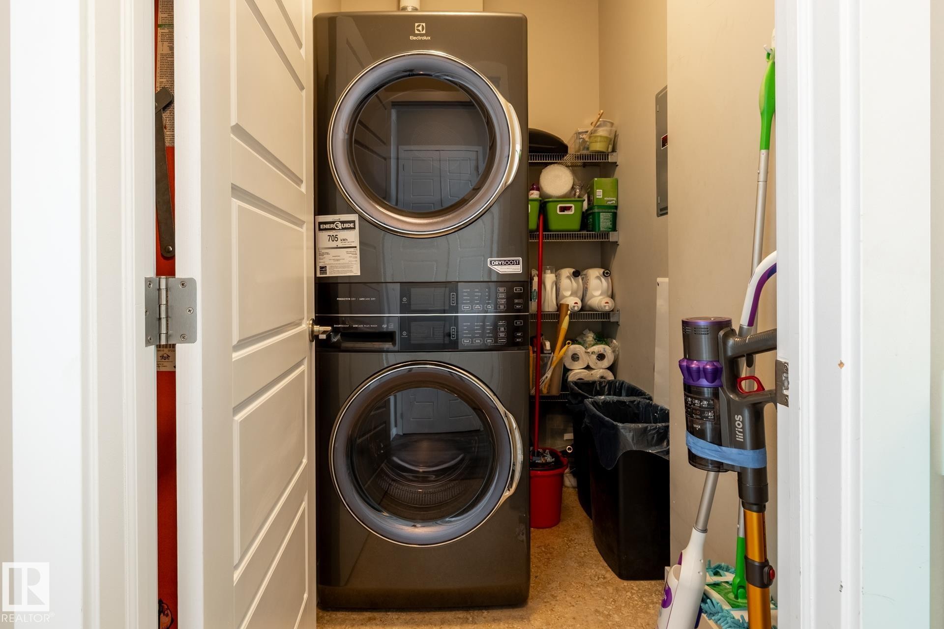 Laundry room with stacked washer / drying machine - 407 2590 Anderson Way, Edmonton, AB - Indoor Photo Showing Laundry Room