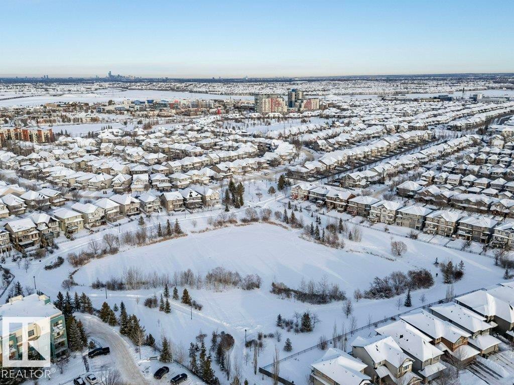 Snowy aerial view with a residential view - 407 2590 Anderson Way, Edmonton, AB - Outdoor With View