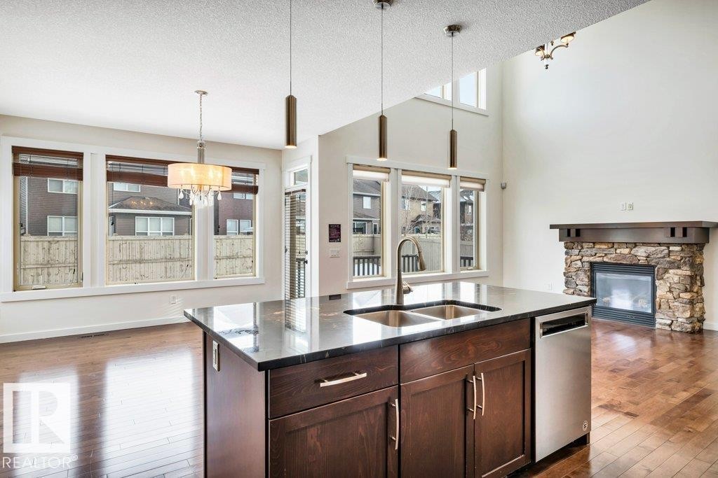 4450 Crabapple Landing, Edmonton, AB - Indoor Photo Showing Kitchen With Fireplace With Double Sink With Upgraded Kitchen