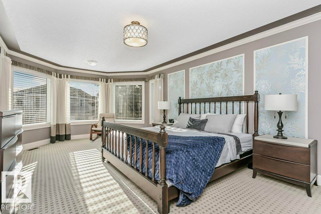 Bedroom with crown molding and light colored carpet - 1579 Hector Road, Edmonton, AB - Indoor Photo Showing Bedroom