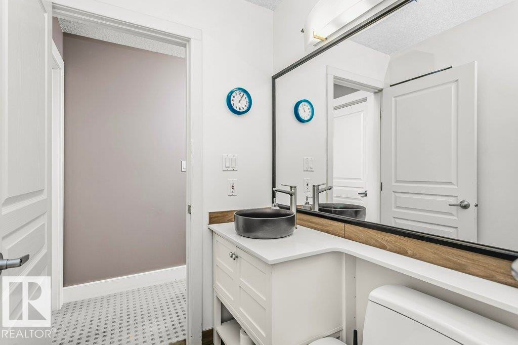 Bathroom featuring vanity and a textured ceiling - 1579 Hector Road, Edmonton, AB - Indoor Photo Showing Bathroom