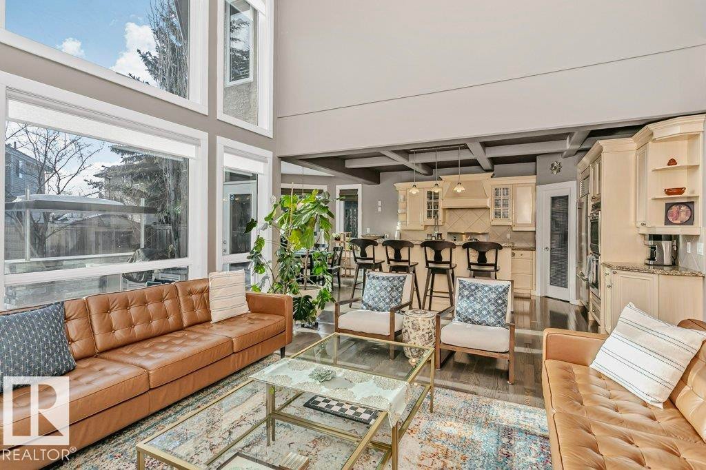 Living room with wood finished floors and a high ceiling - 1579 Hector Road, Edmonton, AB - Indoor Photo Showing Living Room