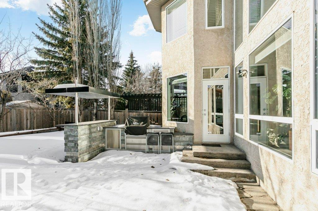 Fenced backyard featuring entry steps, a patio area, and grilling area - 1579 Hector Road, Edmonton, AB - Outdoor