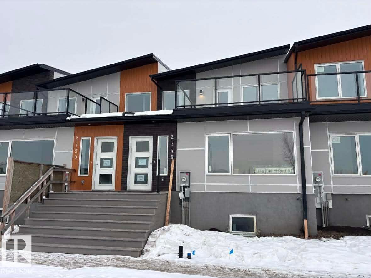 Snow covered property with a balcony - 2748 Blatchford Road, Edmonton, AB - Outdoor With Balcony