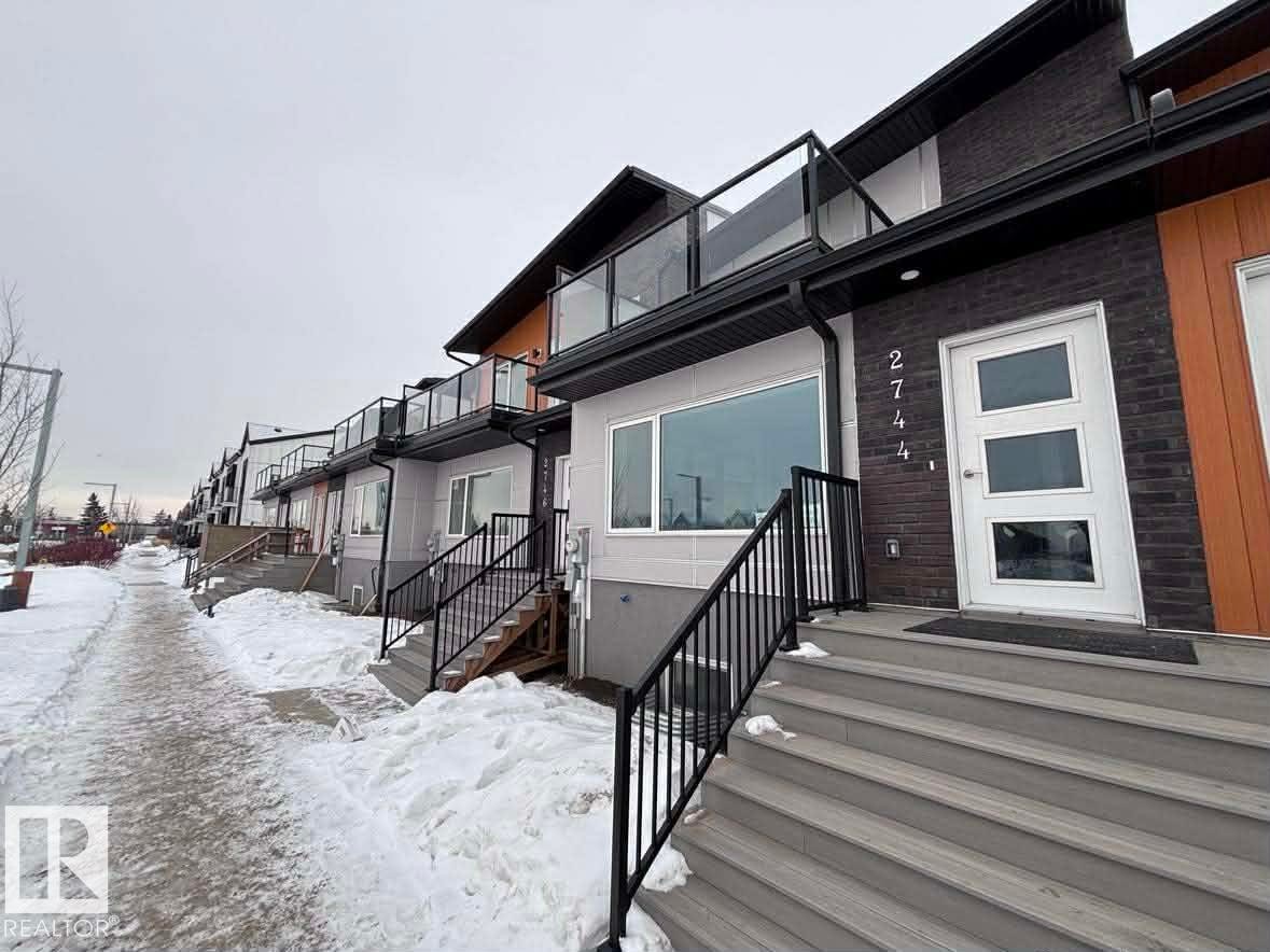 View of snow covered property entrance - 2750 Blatchford Road Nw, Edmonton, AB - Outdoor
