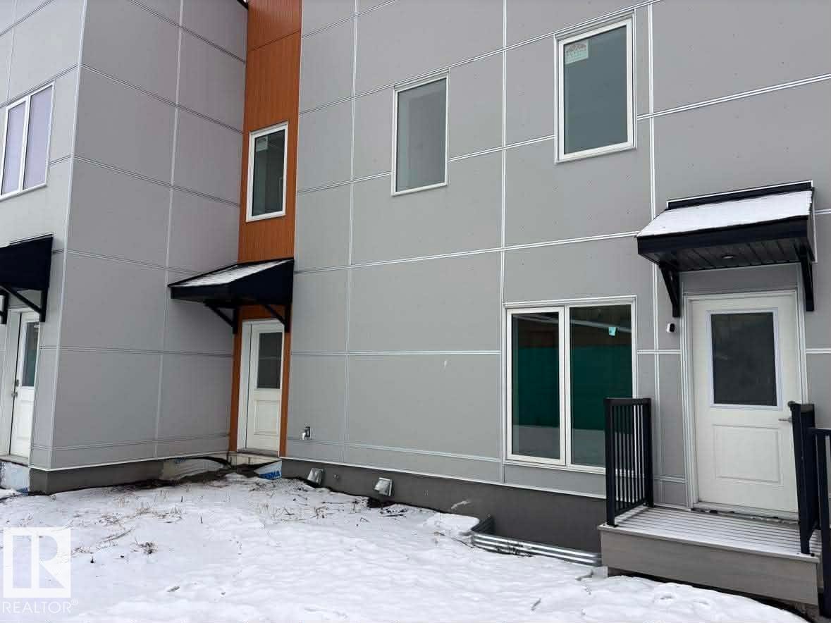 View of snow covered house - 2750 Blatchford Road Nw, Edmonton, AB - Outdoor With Exterior