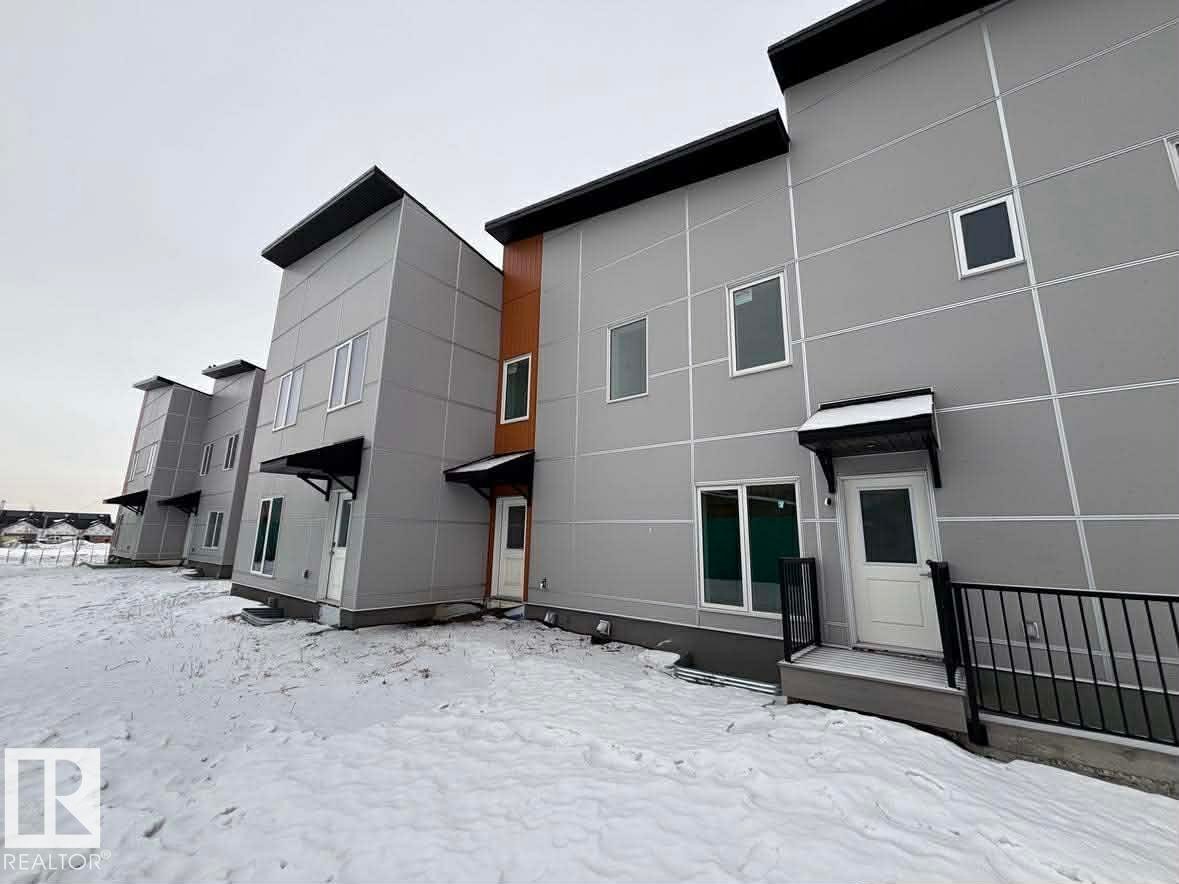 View of snow covered back of property - 2750 Blatchford Road Nw, Edmonton, AB - Outdoor With Exterior