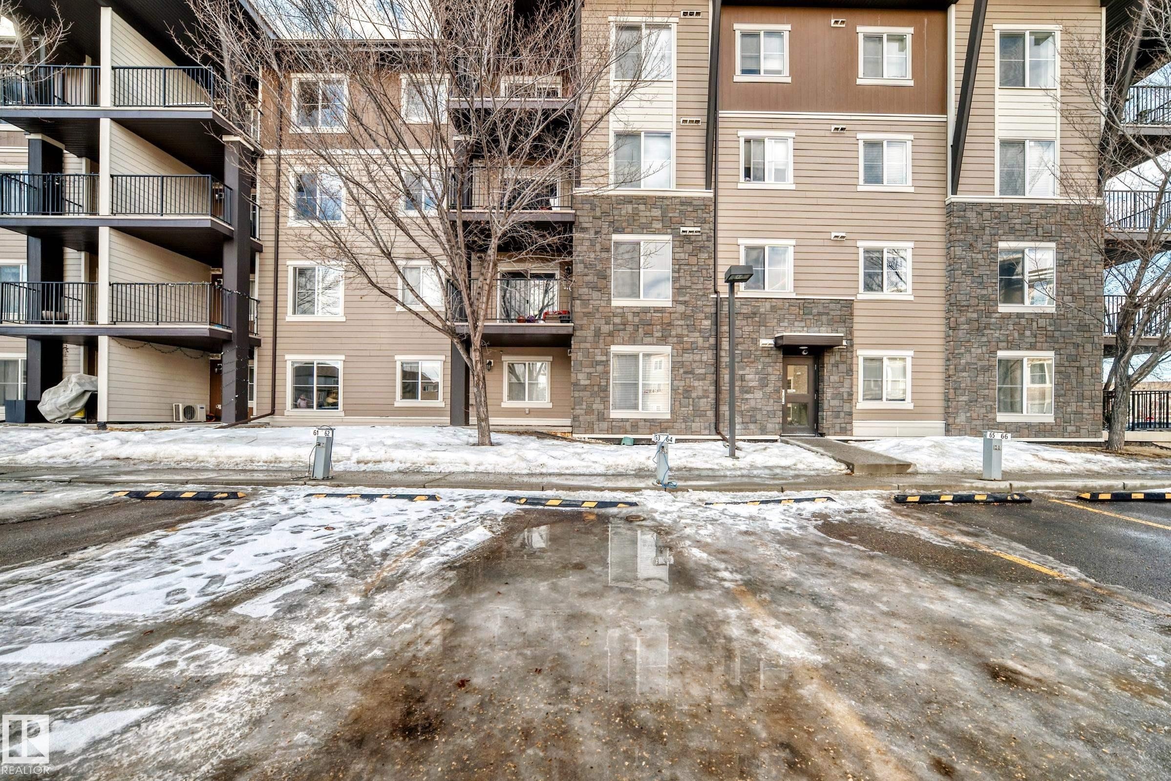 Snow covered building with a view of apartment building / complex - 302 530 Watt Boulevard Sw, Edmonton, AB - Outdoor With Balcony With Facade