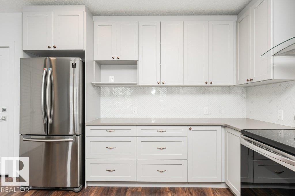 306 1316 Windermere Way, Edmonton, AB - Indoor Photo Showing Kitchen With Stainless Steel Kitchen
