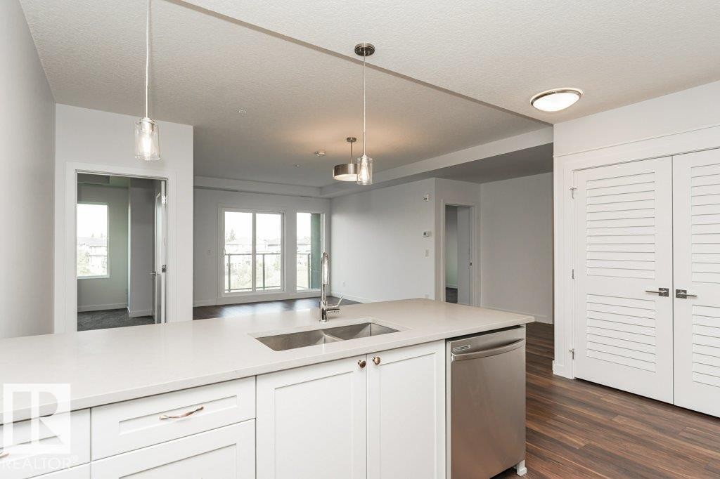 306 1316 Windermere Way, Edmonton, AB - Indoor Photo Showing Kitchen With Double Sink
