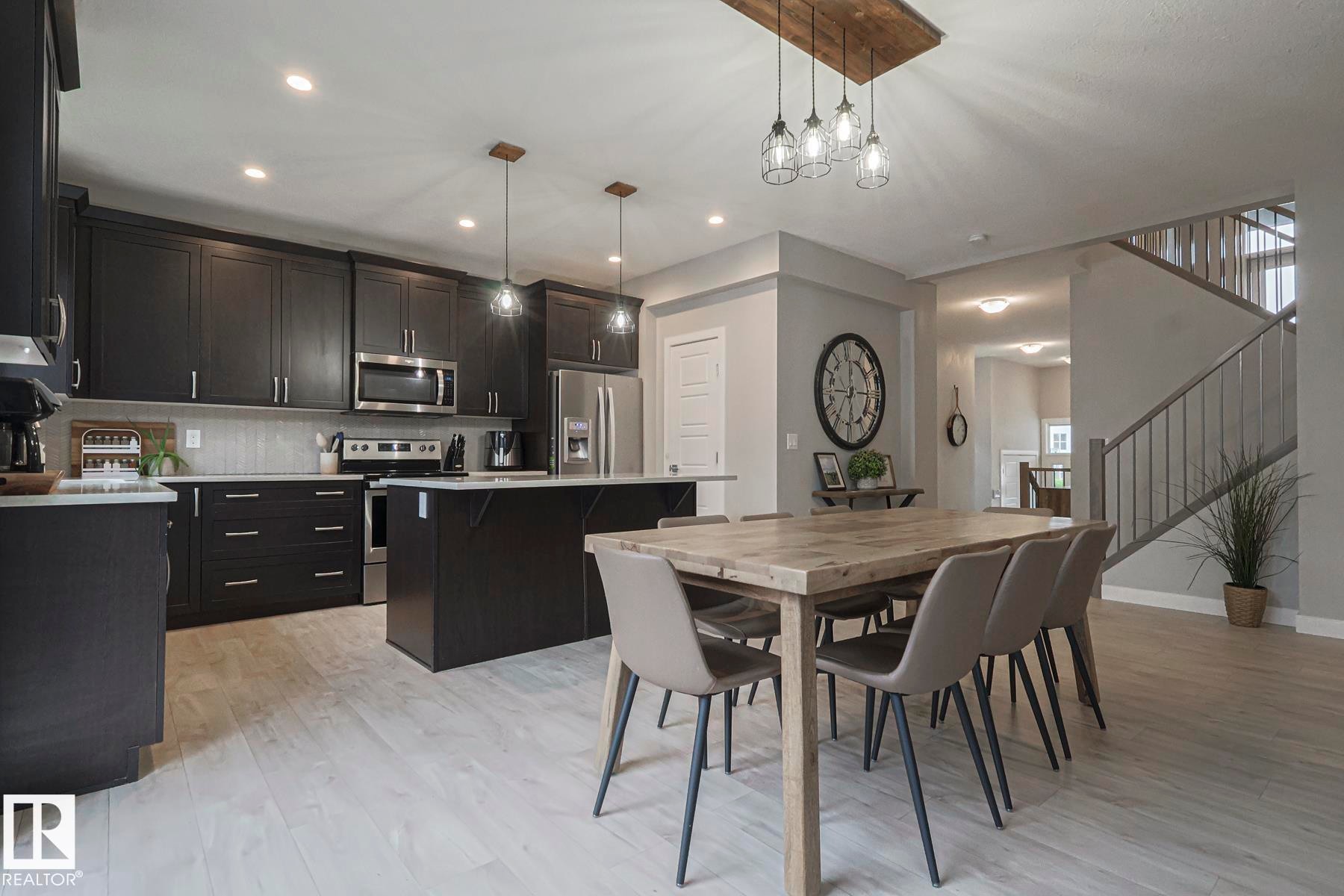 Dining area featuring light wood-type flooring and recessed lighting - 2011 201 Street, Edmonton, AB - Indoor