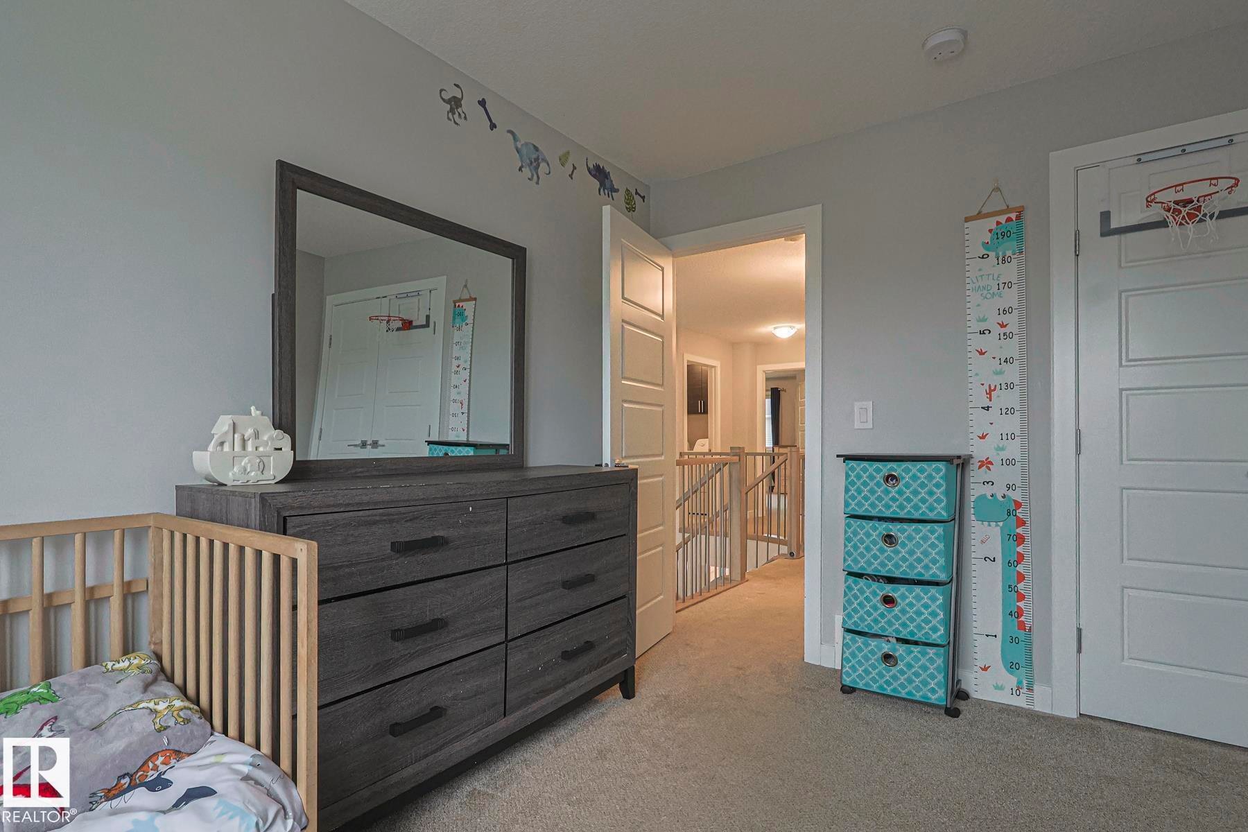 Bedroom with carpet and a nursery area - 2011 201 Street, Edmonton, AB - Indoor Photo Showing Bedroom