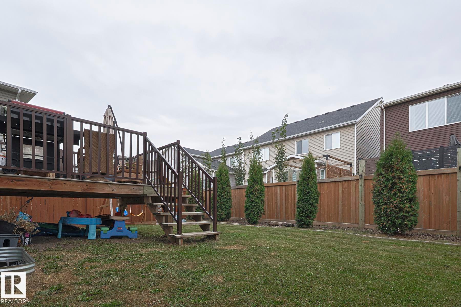 Fenced yard featuring a wooden deck and stairs - 2011 201 Street, Edmonton, AB - Outdoor With Deck Patio Veranda
