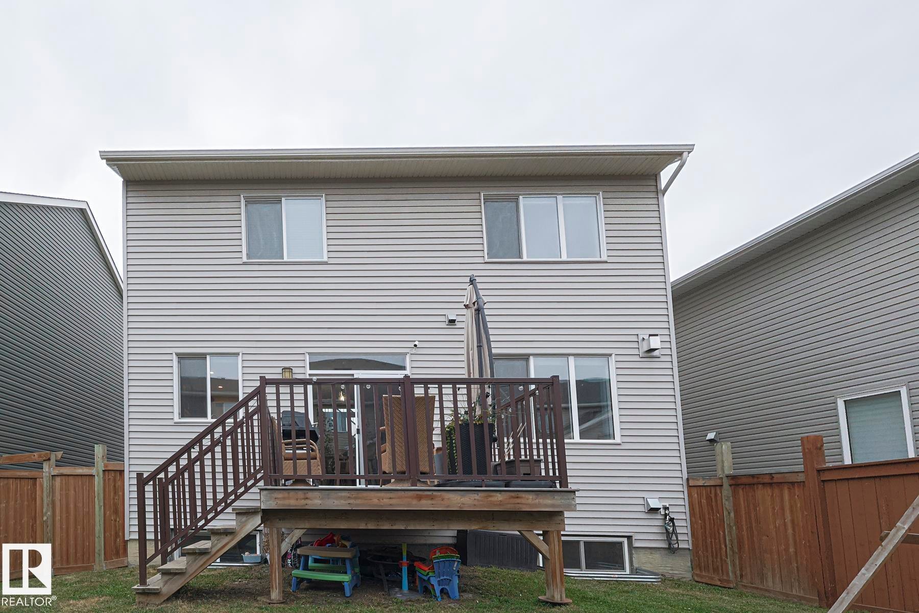 Back of property with a wooden deck and stairway - 2011 201 Street, Edmonton, AB - Outdoor With Deck Patio Veranda With Exterior
