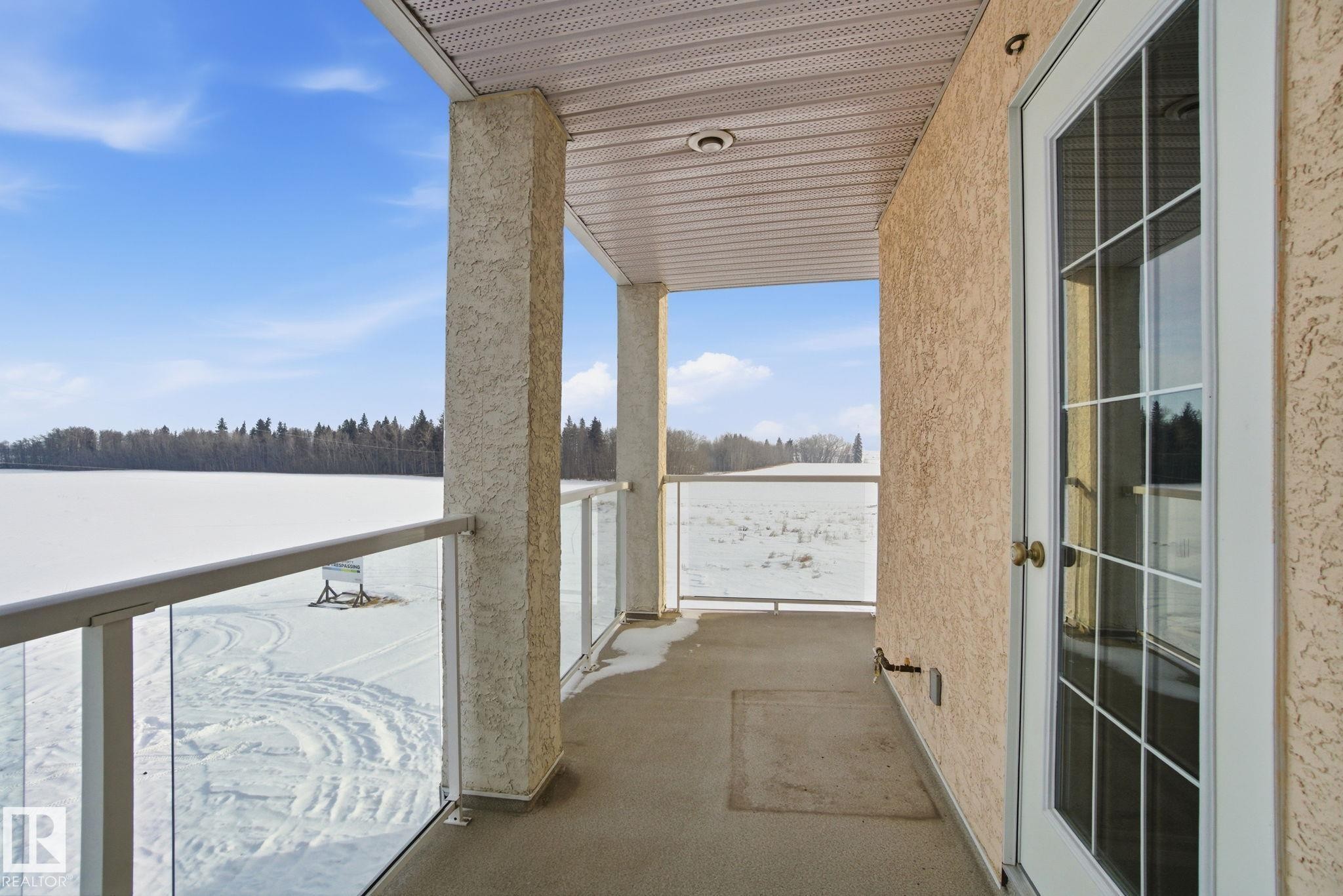 320 7801 Golf Course Road, Stony Plain, AB - Outdoor With Body Of Water With Balcony With Exterior