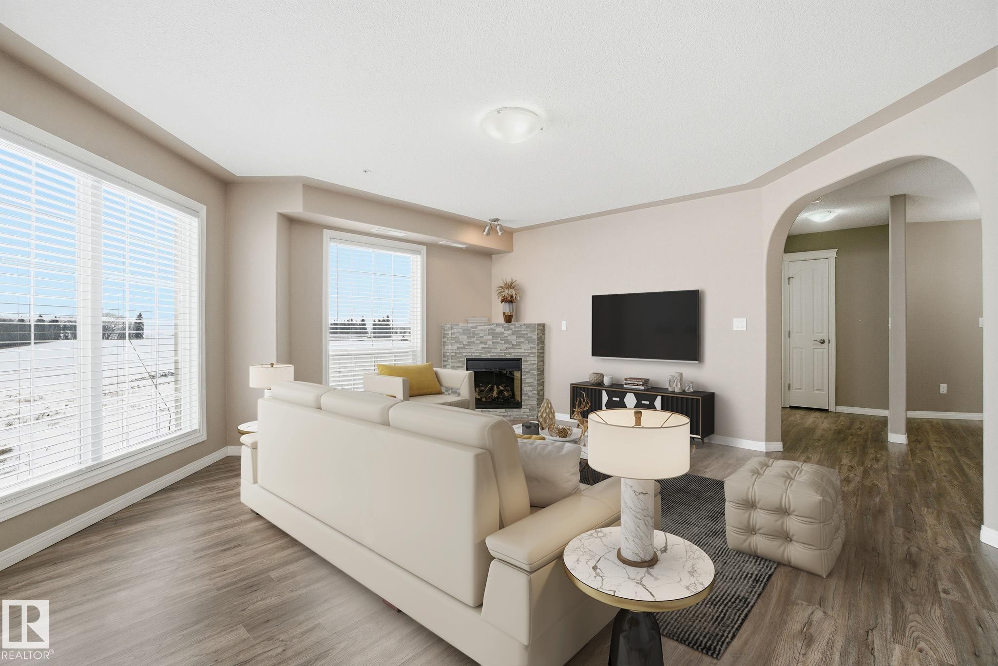 320 7801 Golf Course Road, Stony Plain, AB - Indoor Photo Showing Living Room With Fireplace