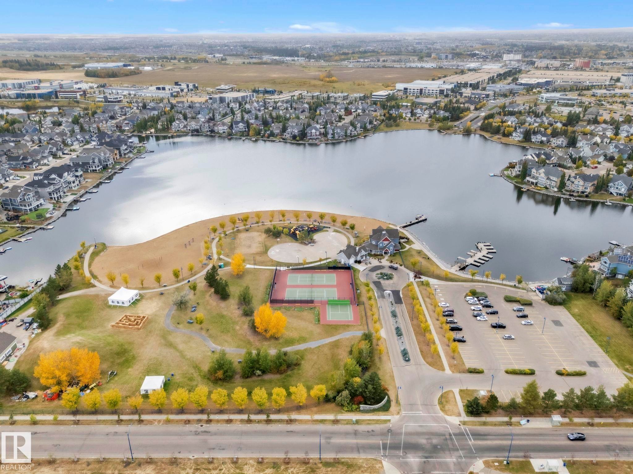 This could be yours!! Just a block away from your home is this man made lake with all the benefits! - 1217 Summerside Drive, Edmonton, AB - Outdoor With Body Of Water With View