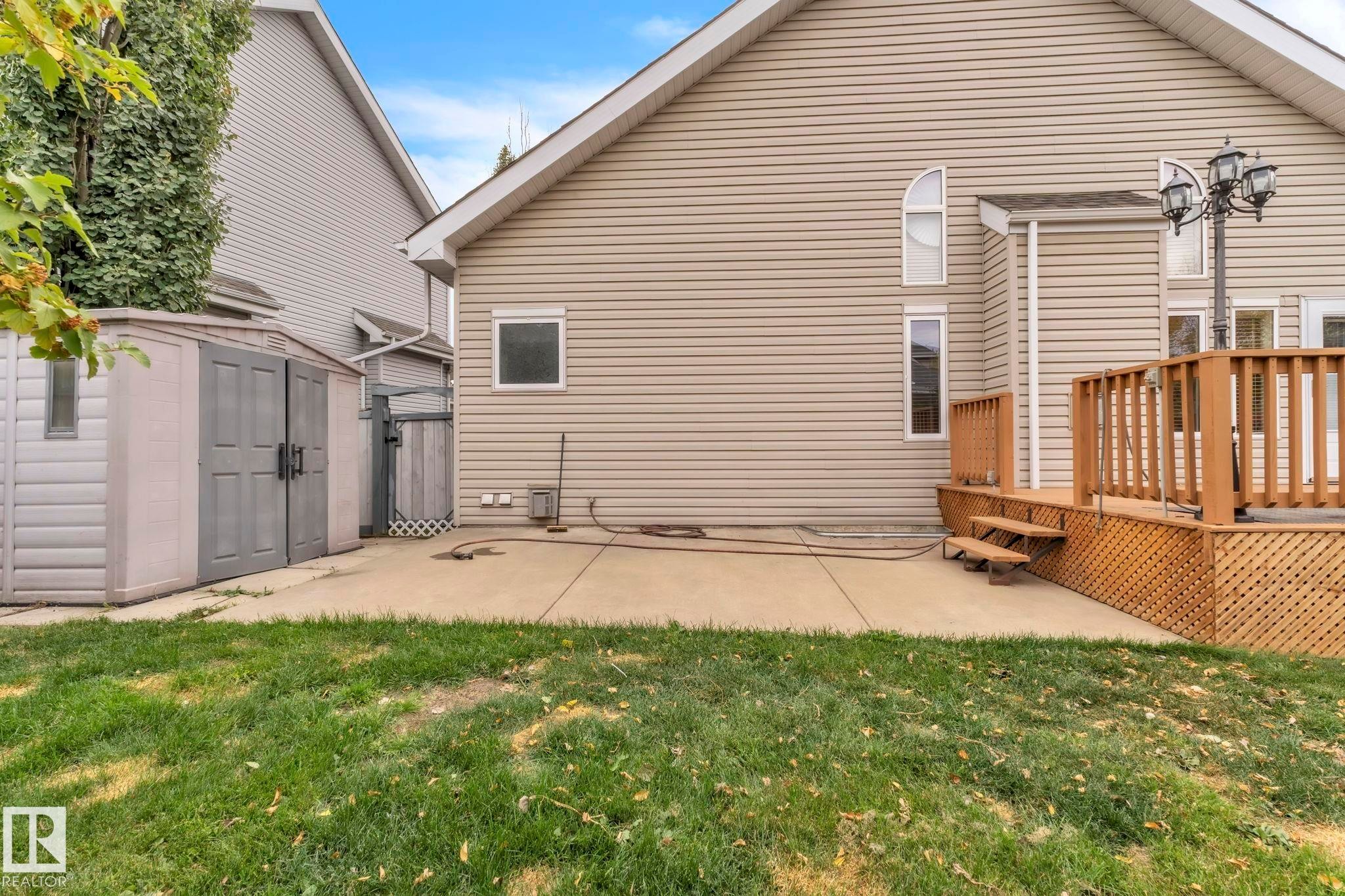 Not only do you have a large deck, but you also have added space on the concrete pad! - 1217 Summerside Drive, Edmonton, AB - Outdoor With Deck Patio Veranda With Exterior