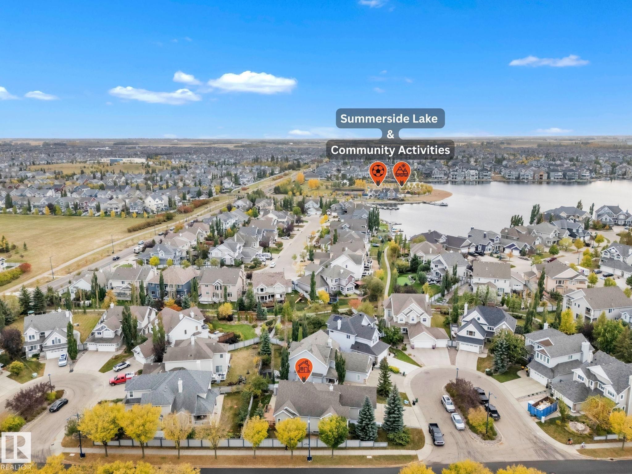 Aerial perspective of suburban area with a nearby body of water - 1217 Summerside Drive, Edmonton, AB - Outdoor With Body Of Water With View