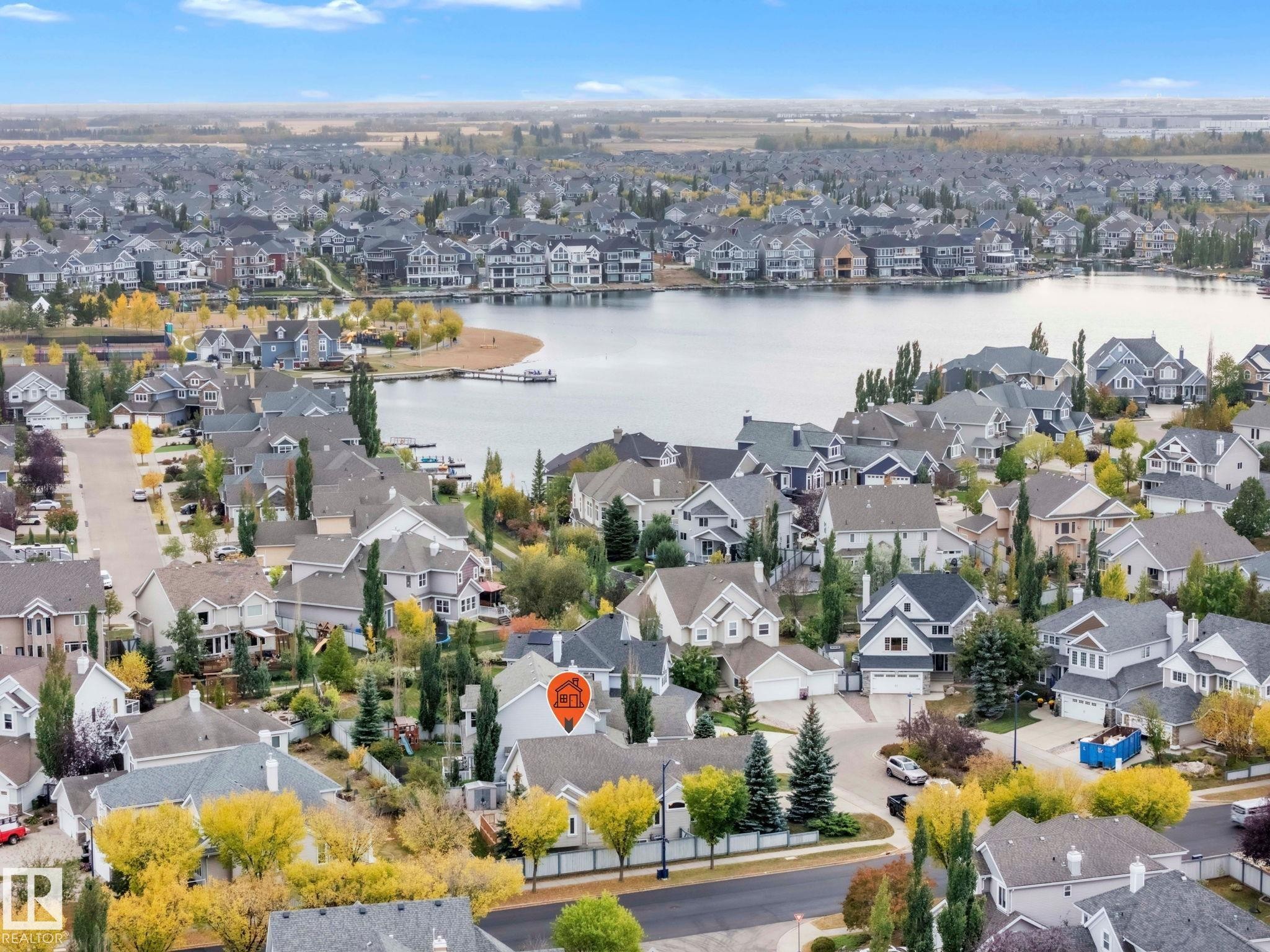 Just a hop, skip and jump to the lake - yearly fee includes use of the non motorized sports items - - 1217 Summerside Drive, Edmonton, AB - Outdoor With Body Of Water With View