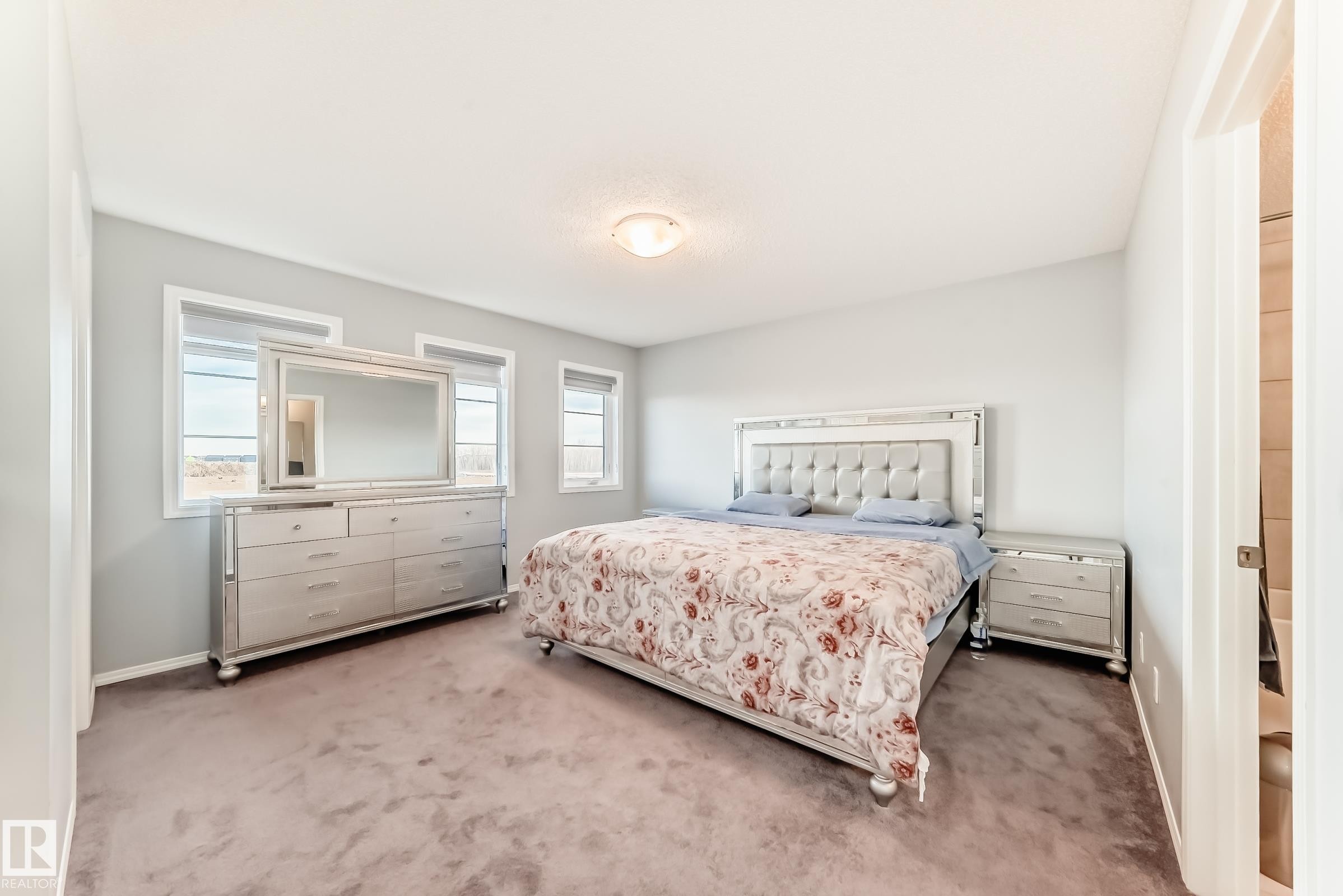 Bedroom with carpet flooring and baseboards - 1002 Stillwater Boulevard, Edmonton, AB - Indoor Photo Showing Bedroom