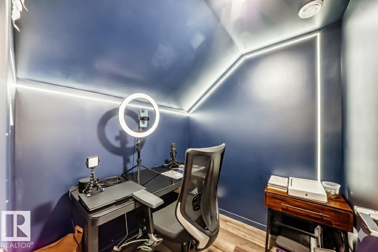 Office area with lofted ceiling and wood finished floors - 1002 Stillwater Boulevard, Edmonton, AB - Indoor Photo Showing Office