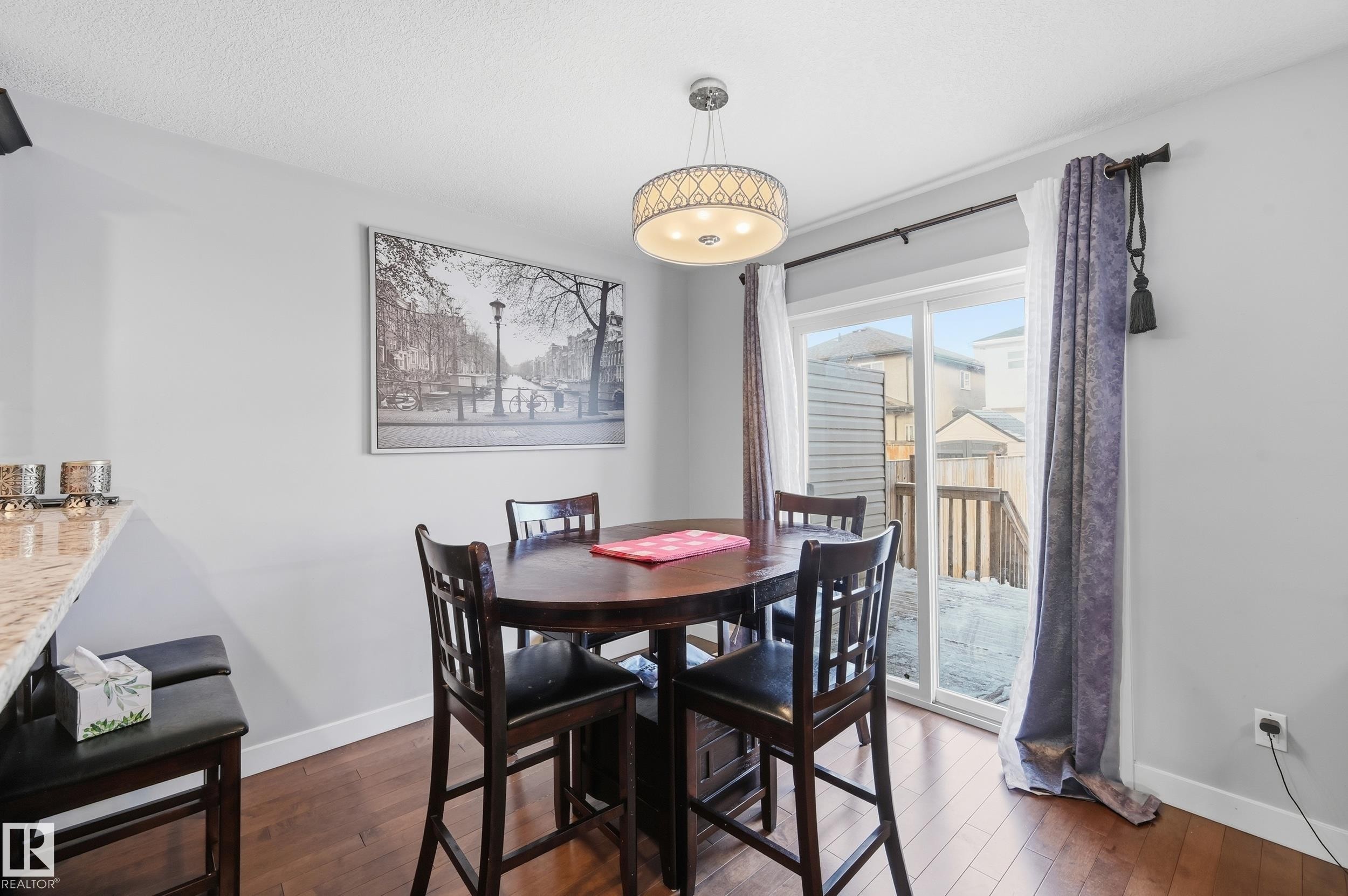 Dining area with dark wood finished floors - 5978 167C Avenue, Edmonton, AB - Indoor Photo Showing Dining Room