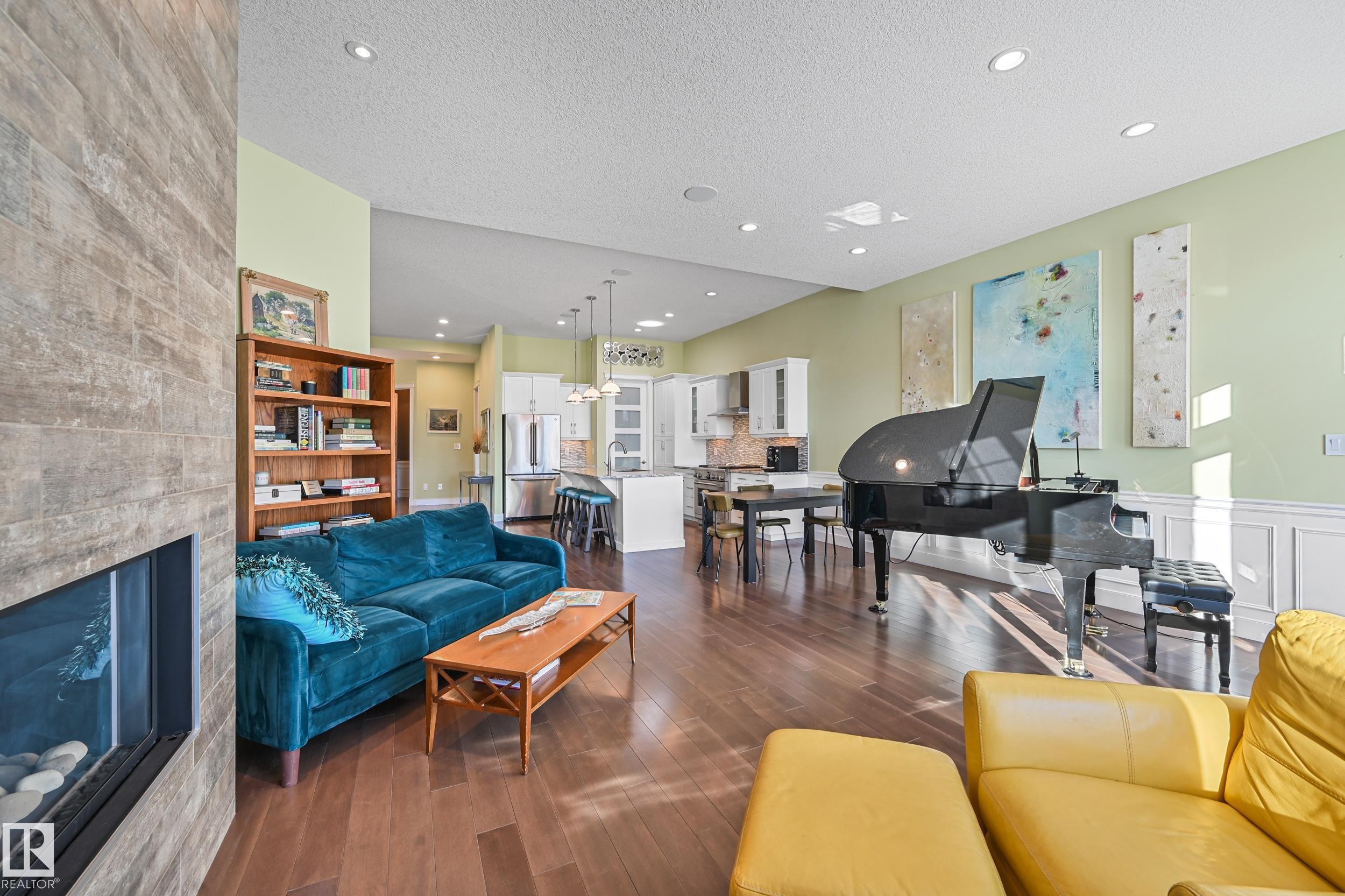 1 7570 May Common, Edmonton, AB - Indoor Photo Showing Living Room With Fireplace