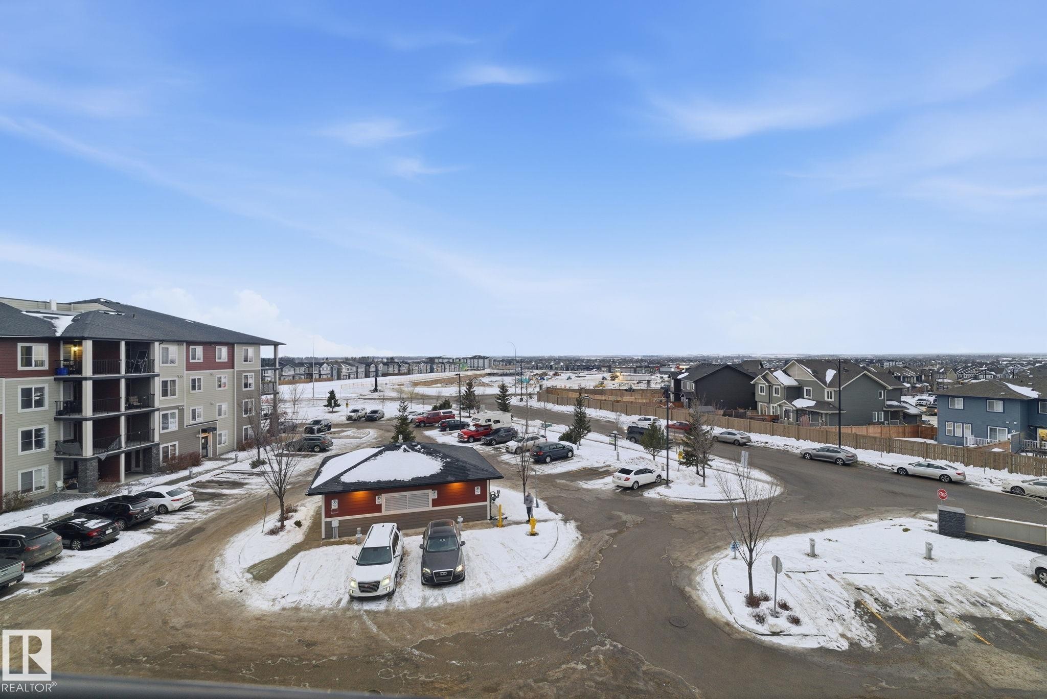 Snowy aerial view with a residential view - 424 1510 Watt Drive, Edmonton, AB - Outdoor With View