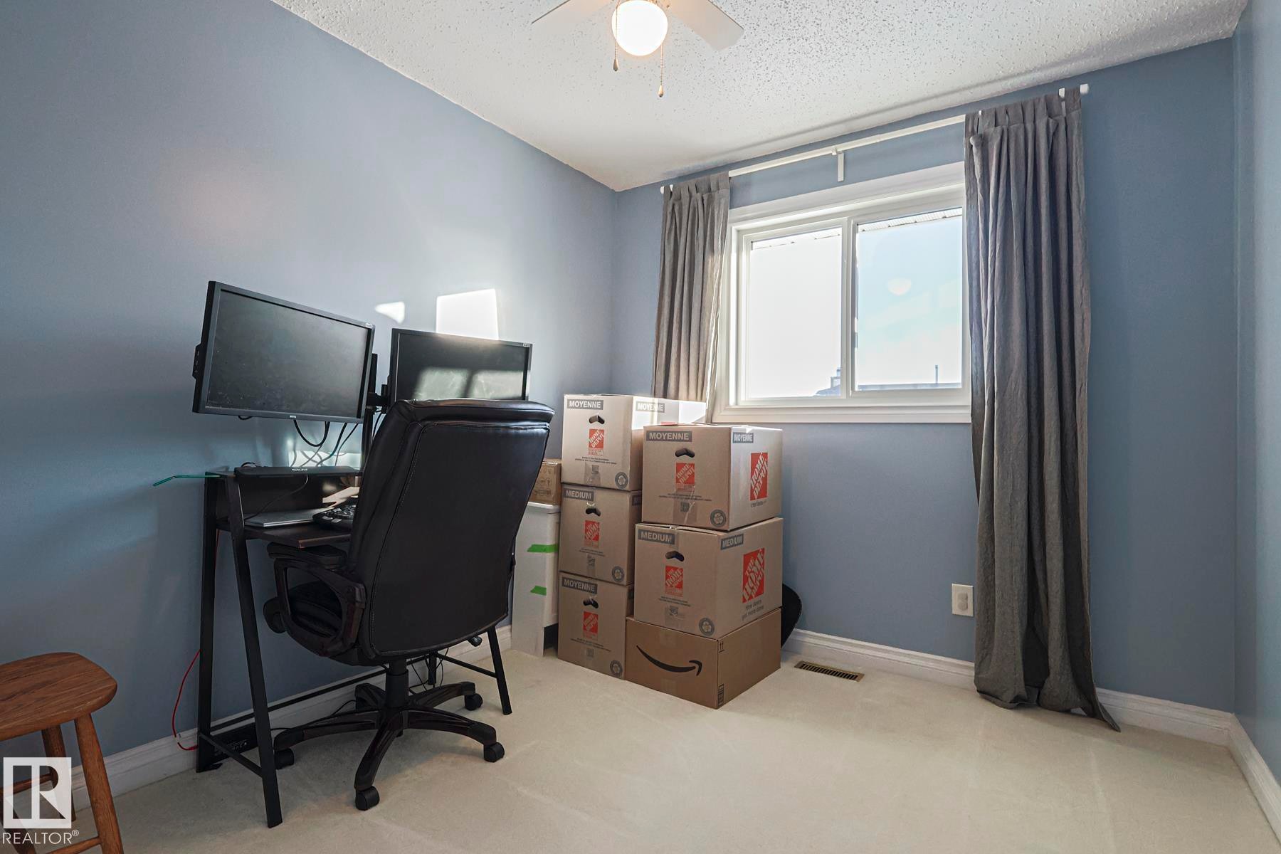 Home office with light carpet, a textured ceiling, and ceiling fan - 192 Dunluce Road, Edmonton, AB - Indoor Photo Showing Office