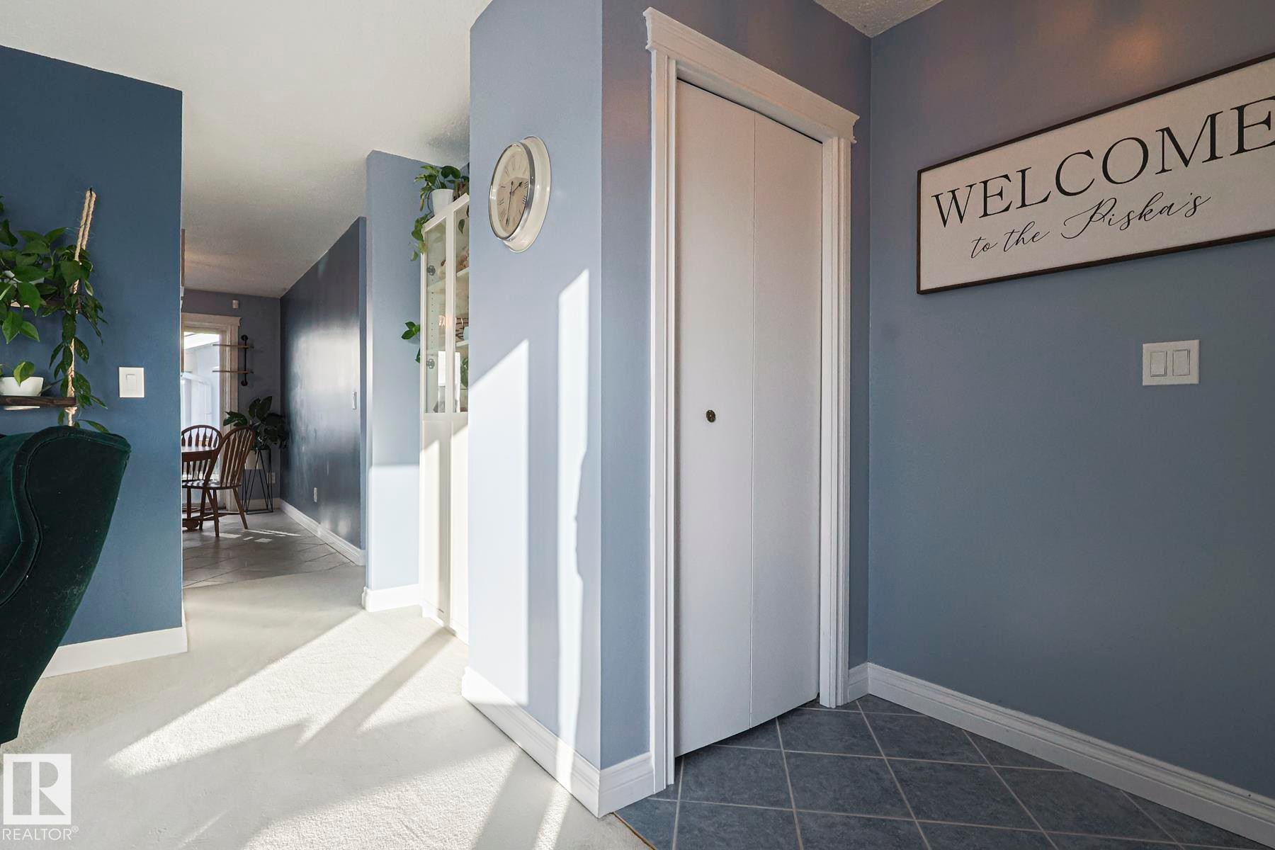 Hallway featuring baseboards and dark carpet - 192 Dunluce Road, Edmonton, AB - Indoor Photo Showing Other Room