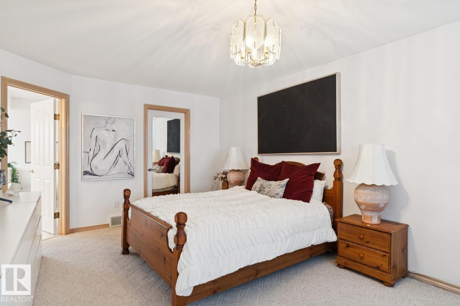 Bedroom featuring light colored carpet and a chandelier - 8617 158A Avenue, Edmonton, AB - Indoor Photo Showing Bedroom