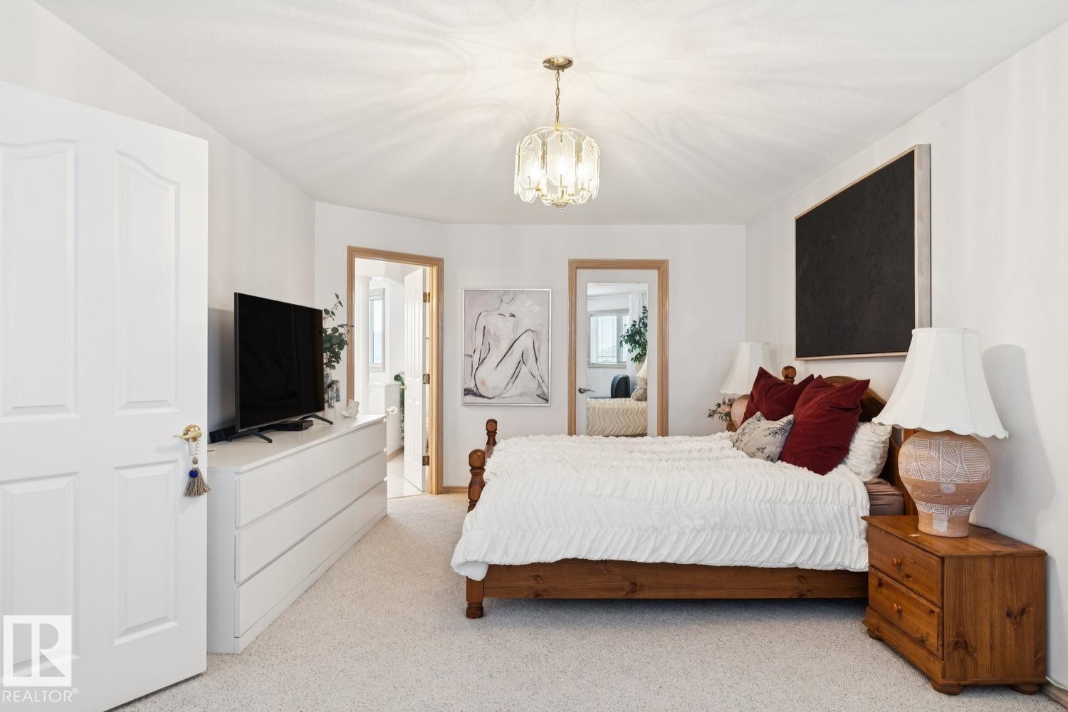 Bedroom with carpet floors and a chandelier - 8617 158A Avenue, Edmonton, AB - Indoor Photo Showing Bedroom