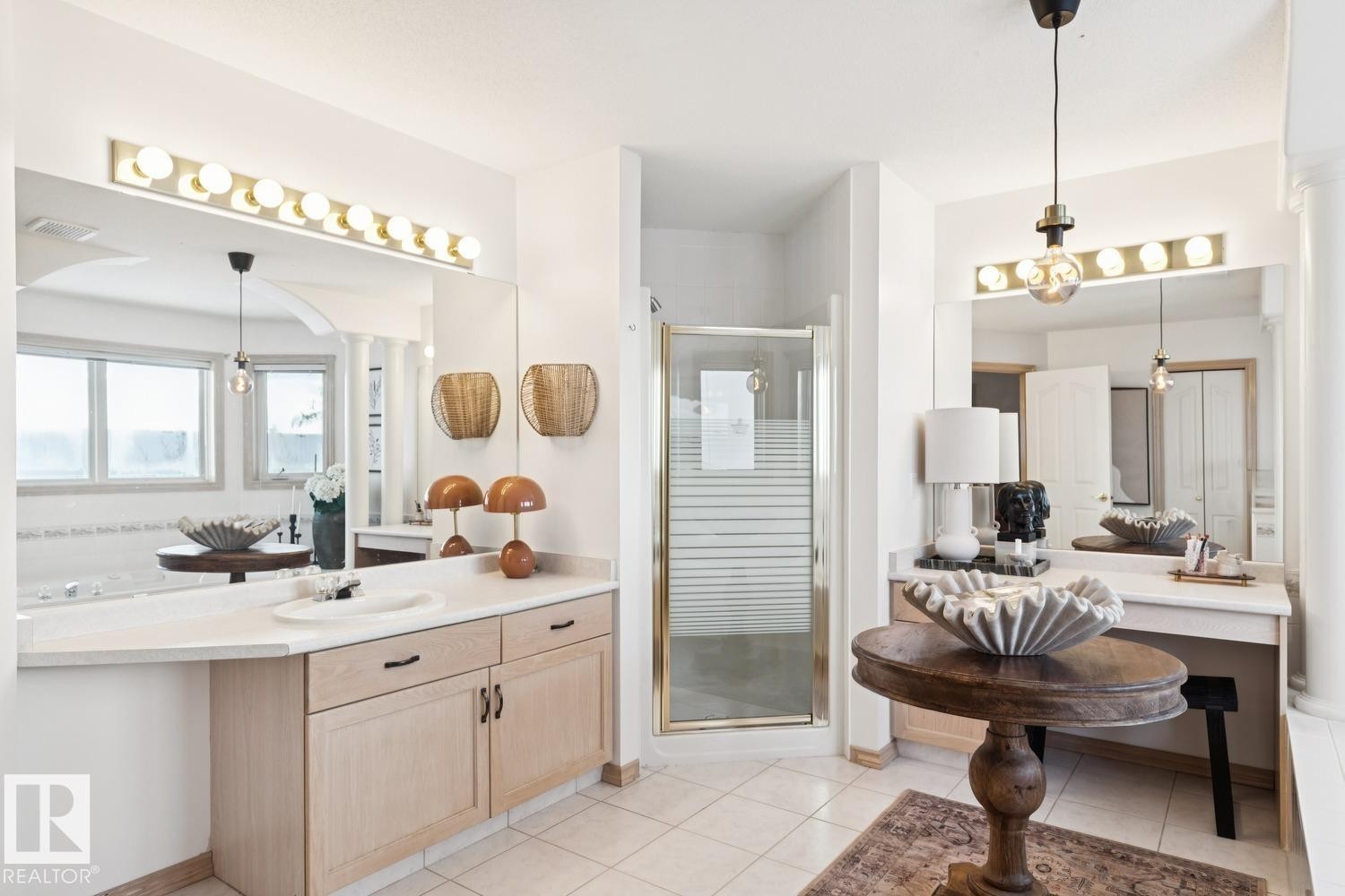 Full bath featuring vanity, a stall shower, and light tile patterned floors - 8617 158A Avenue, Edmonton, AB - Indoor
