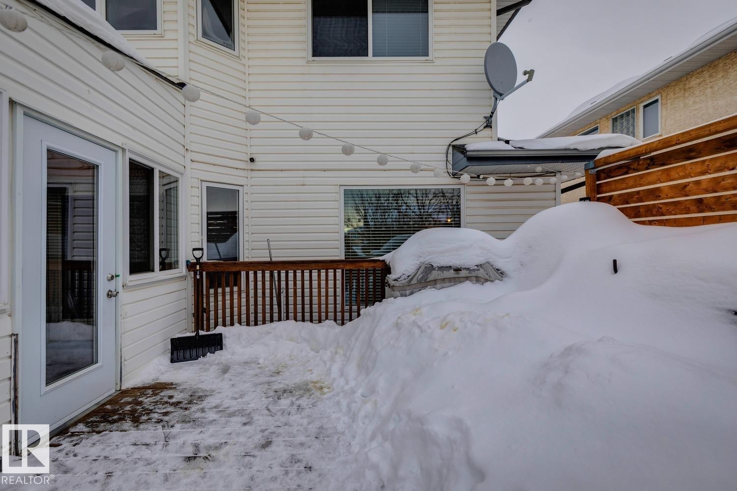 View of snow covered deck - 8617 158A Avenue, Edmonton, AB - Outdoor With Exterior