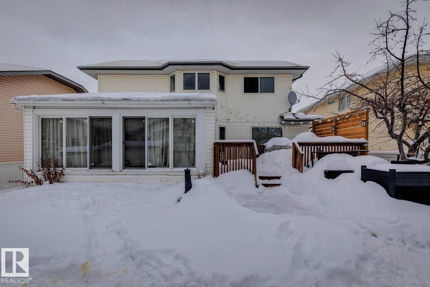 Snow covered house featuring a deck - 8617 158A Avenue, Edmonton, AB - Outdoor