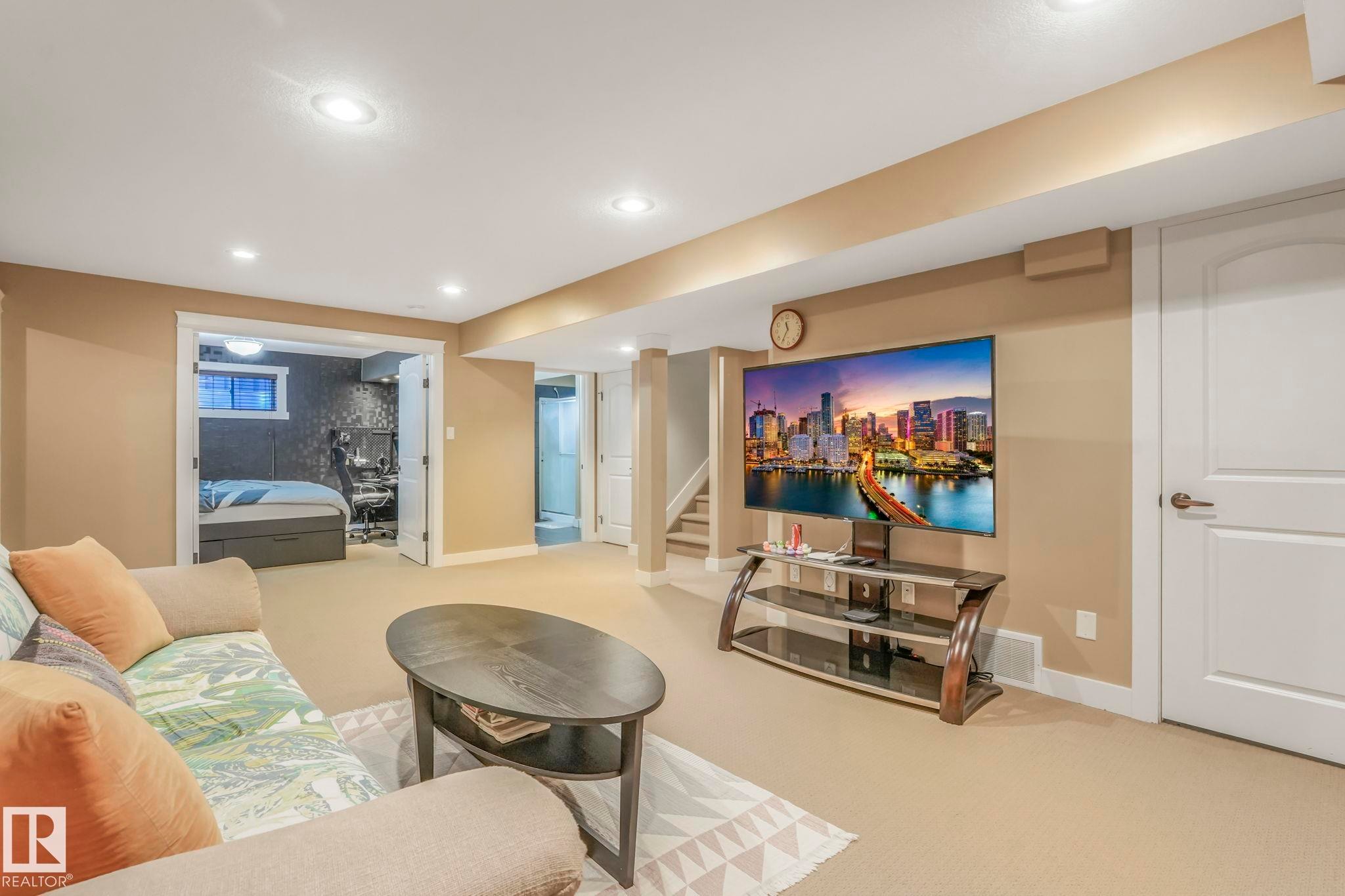 Carpeted living area with stairs and recessed lighting - 2307 Rutherford Way, Edmonton, AB - Indoor