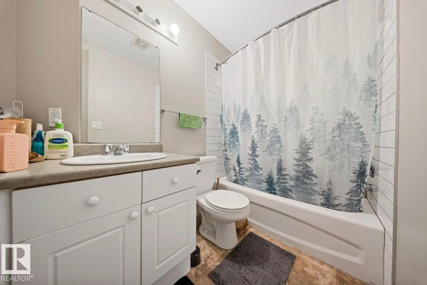 Bathroom with shower / bath combo and vanity - 103 12110 119 Ave, Edmonton, AB - Indoor Photo Showing Bathroom