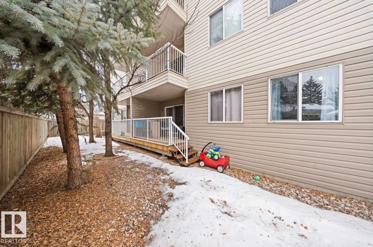 Snow covered house with a balcony - 103 12110 119 Ave, Edmonton, AB - Outdoor With Balcony With Exterior