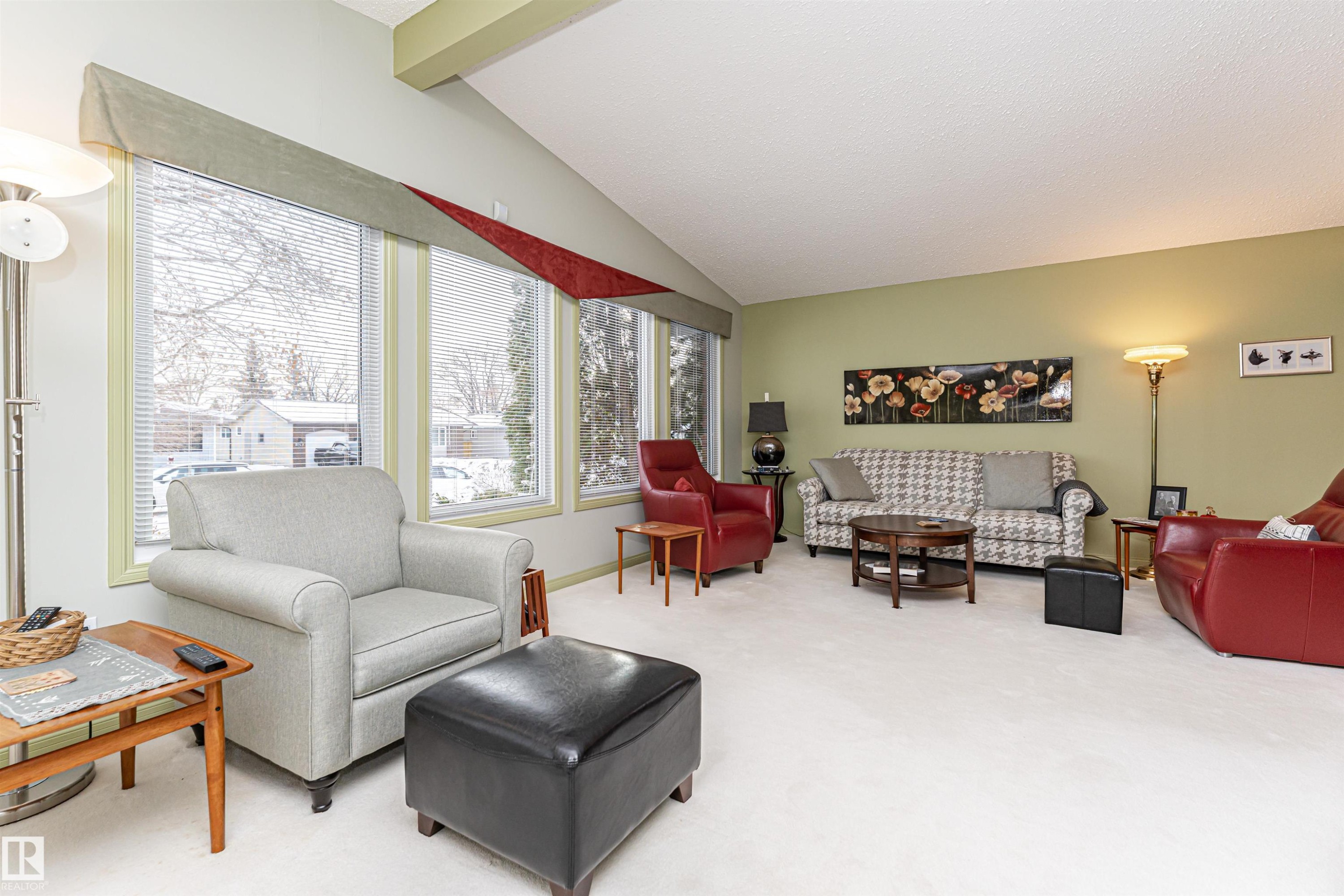 Living area featuring light carpet and lofted ceiling with beams - 2112 67 Street Nw, Edmonton, AB - Indoor Photo Showing Living Room