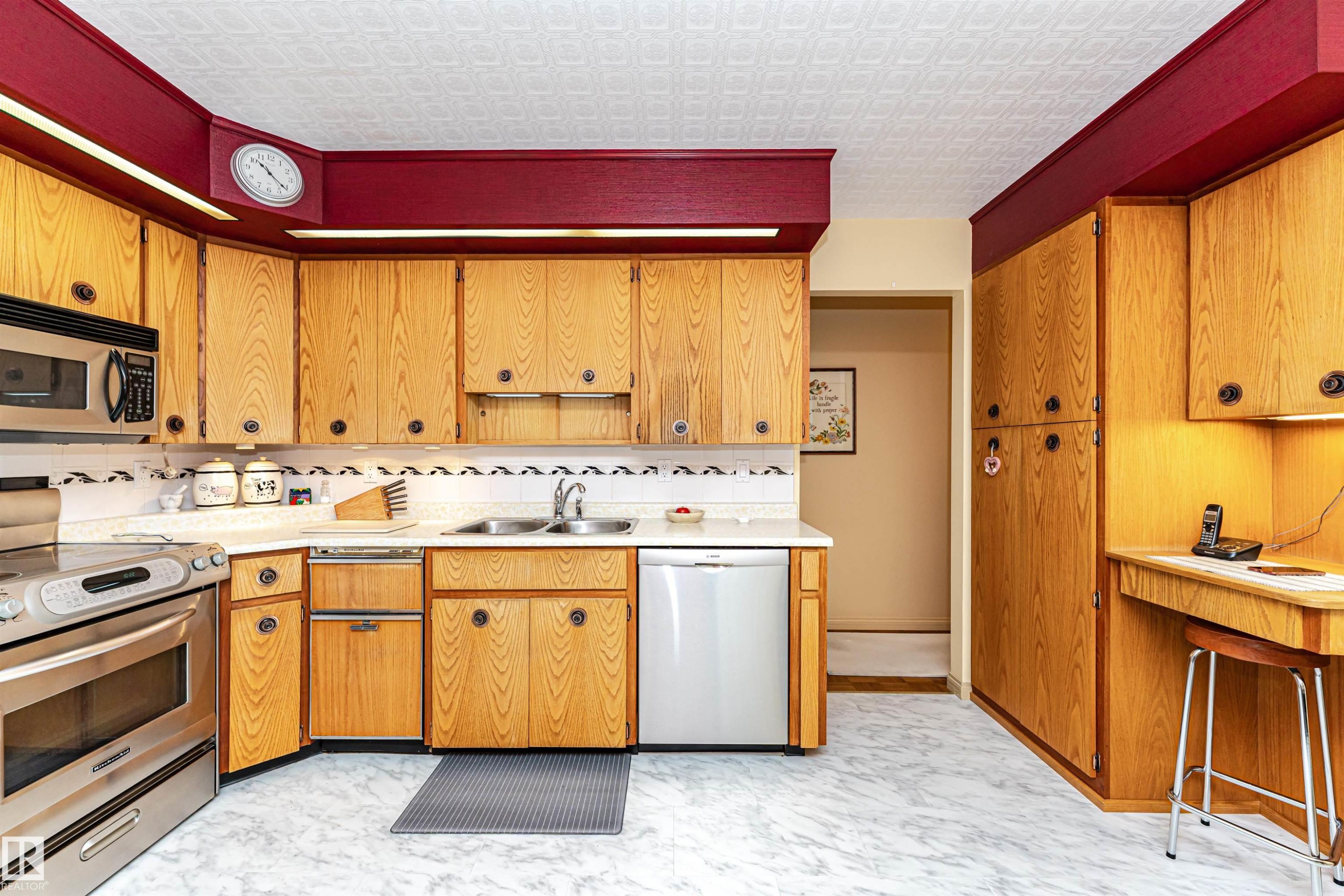 Kitchen with stainless steel appliances, light countertops, and wood finish cabinets - 2112 67 Street Nw, Edmonton, AB - Indoor Photo Showing Kitchen With Double Sink